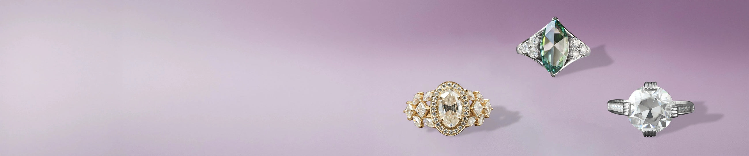 Vintage-inspired moissanite rings featuring oval, kite, and round cuts in gold and silver bands