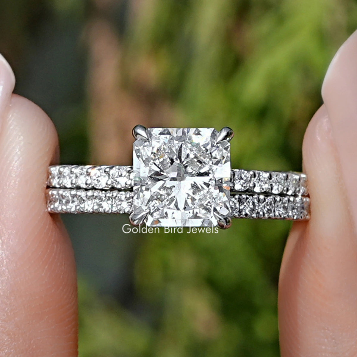 Square Radiant Cut Lab Diamond Bridal Ring Held between fingers