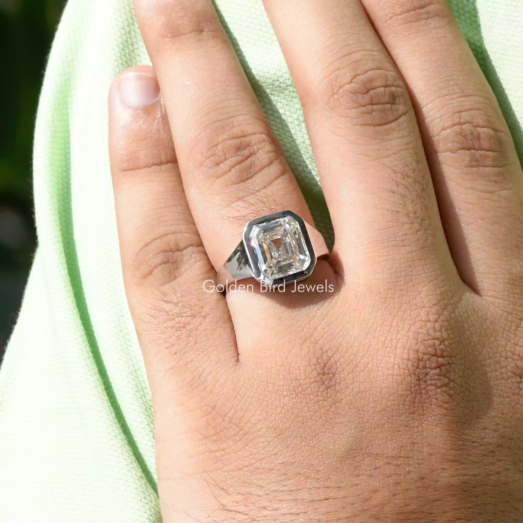 In hand showing view of moissanite Ring
