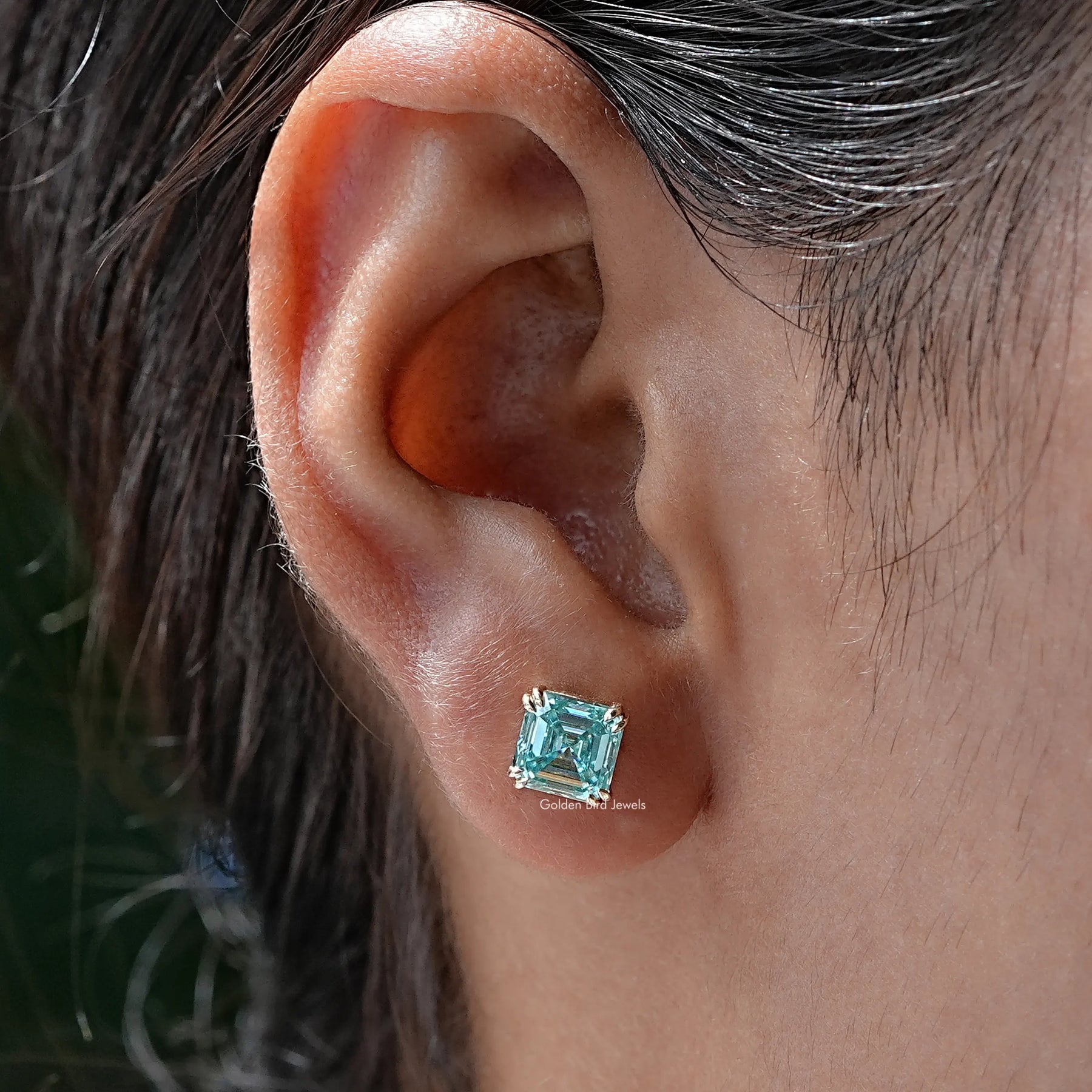 In Ear view of Asscher Cut moissanite Stud Earrings