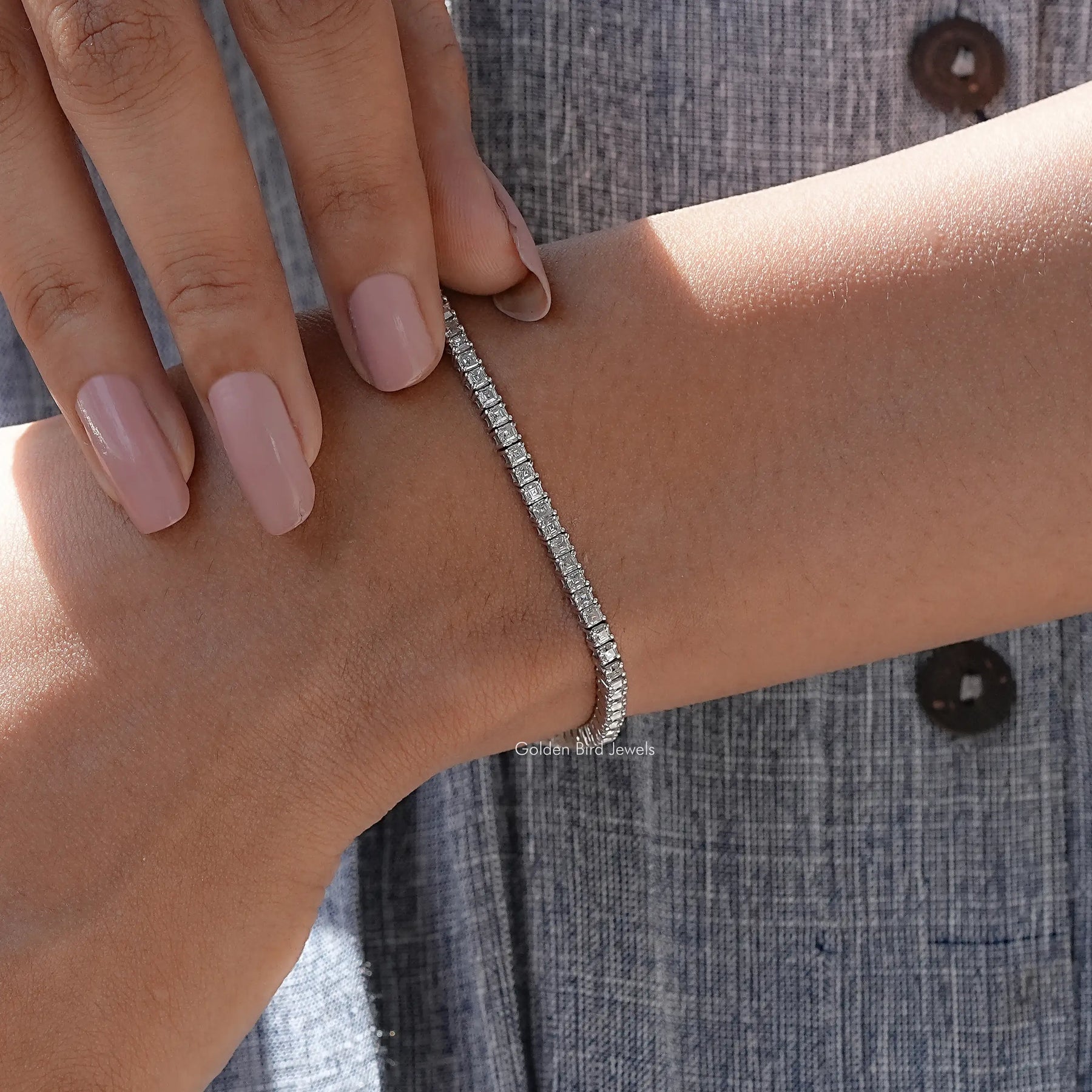 Close view of moissanite tennis bracelet in secure setting