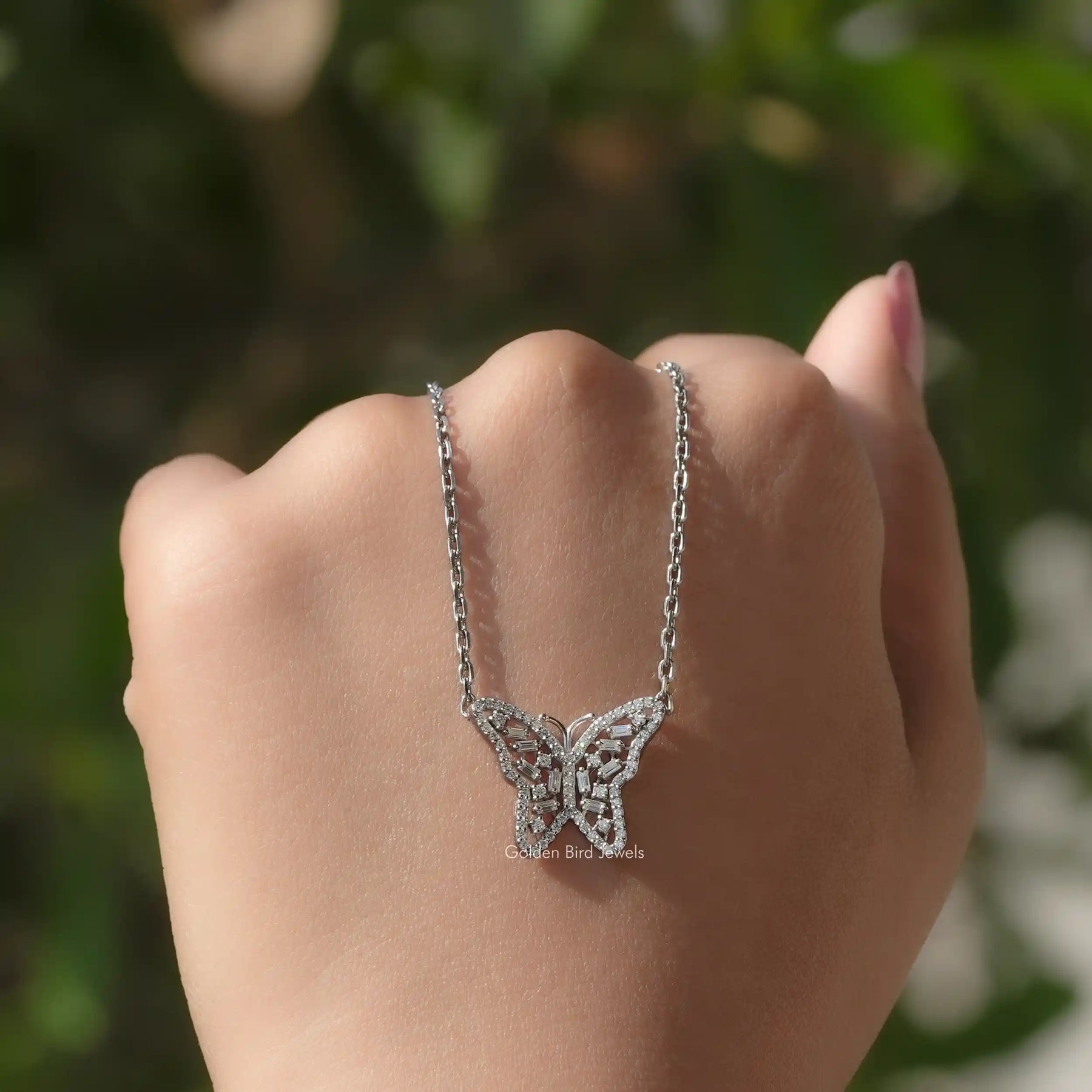 Detailed view of moissanite butterfly shape pendant