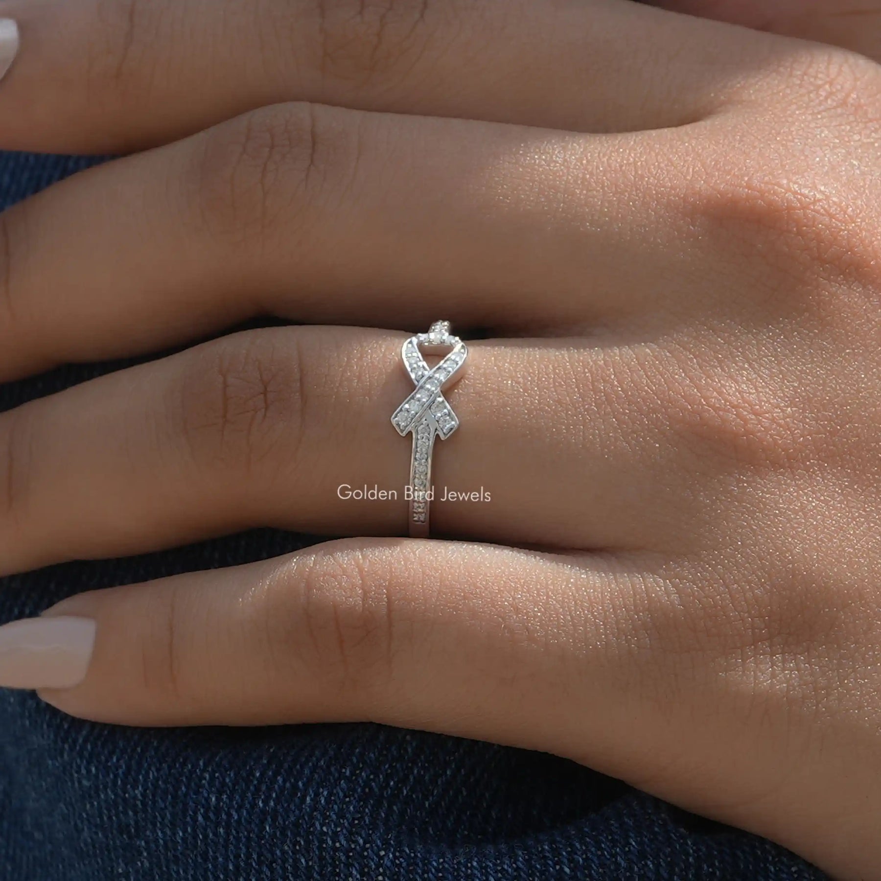 Ribbon Style Round Cut Moissanite Ring In Finger