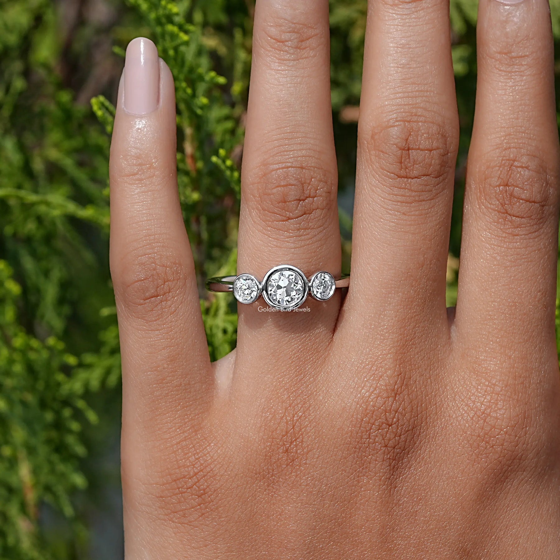 View of Round Cut Lab Diamond Three Stone Ring In White Gold