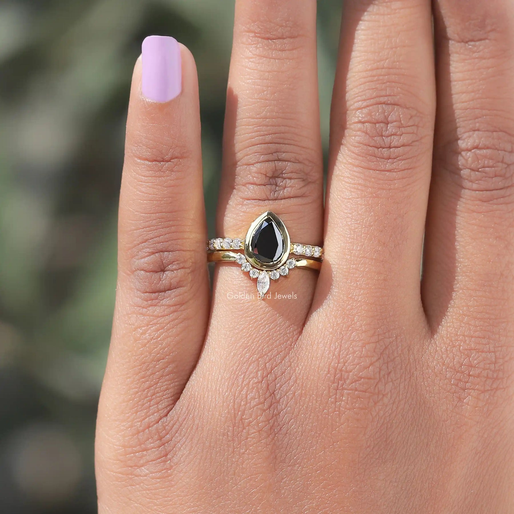 Close-Up View of Pear Cut Moissanite Bridal Ring Set In Yellow Gold