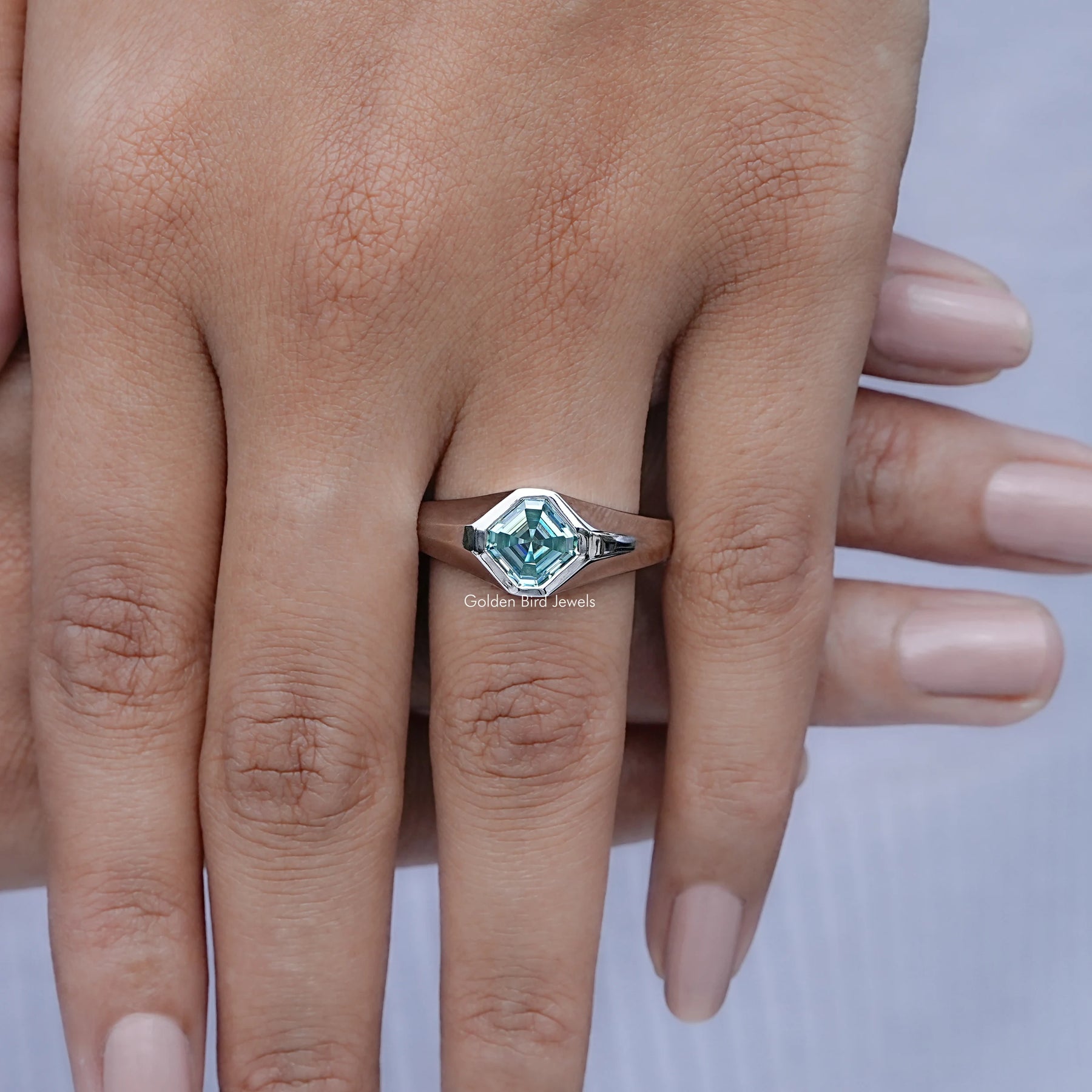 In finger front view of Asscher Moissanite Solitaire Engagement Ring in unique shape