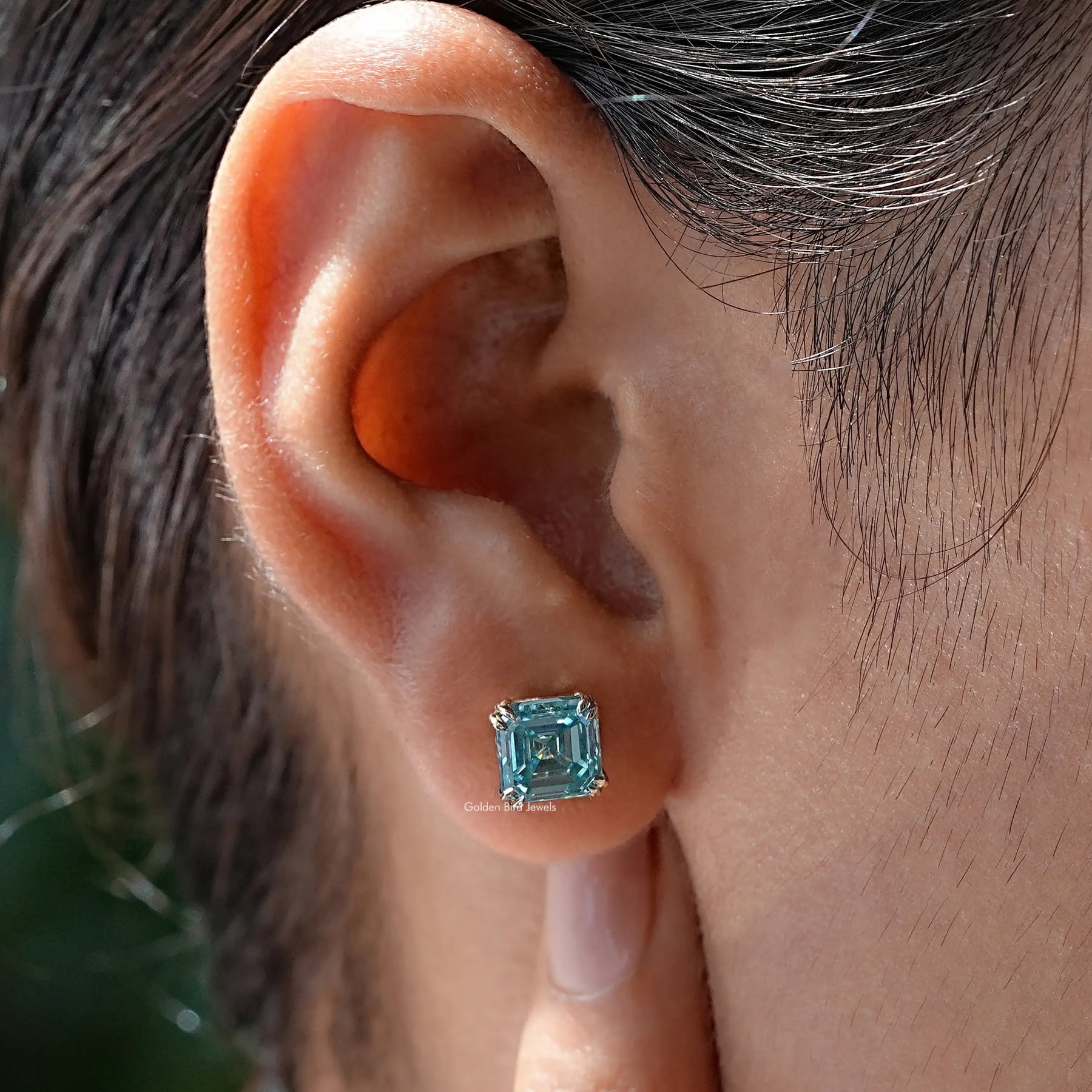 Detailed view of Blue Asscher Cut Moissanite Solitaire Stud Earrings