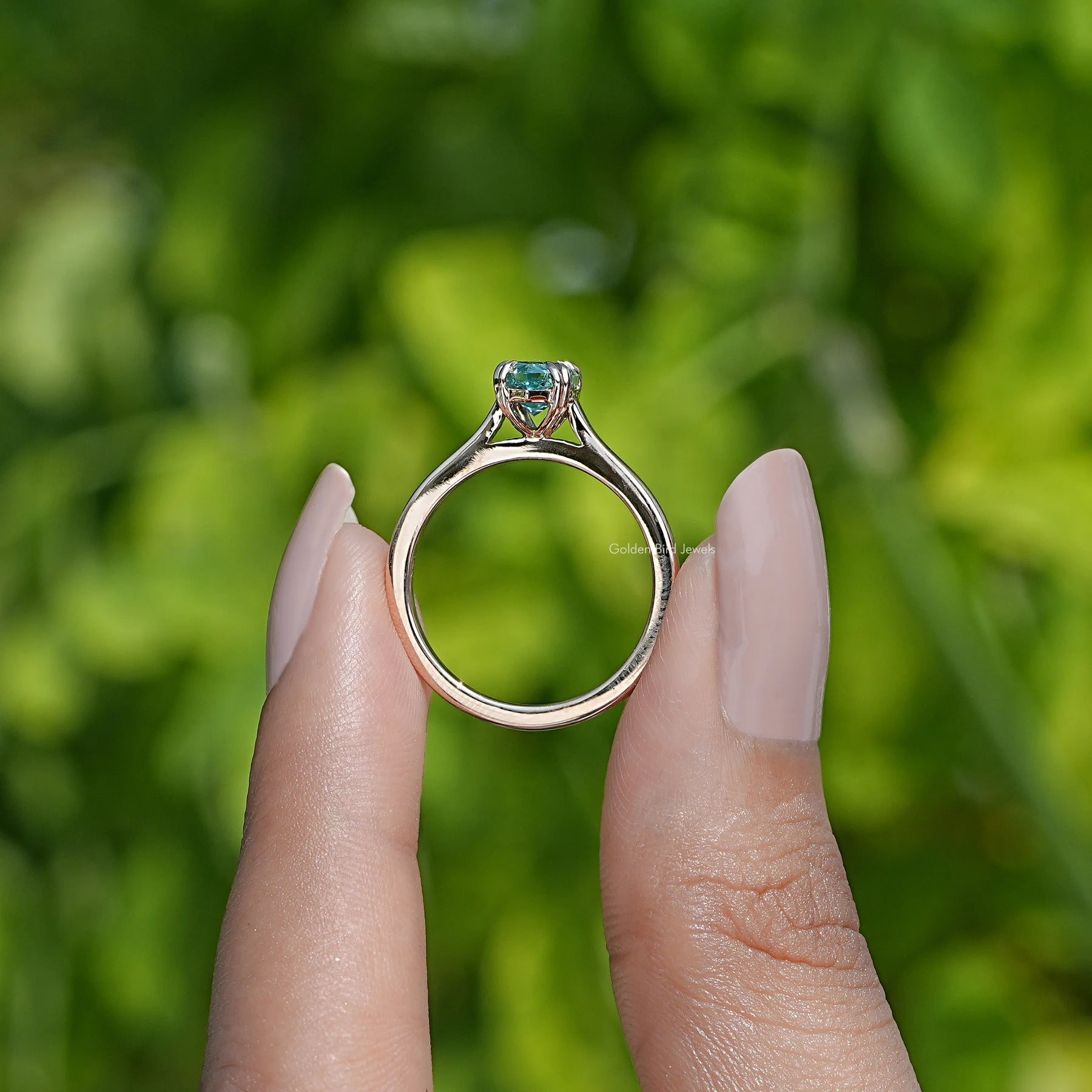 Back View of Marquise Cut Moissanite Solitaire Engagement Ring In two fingers