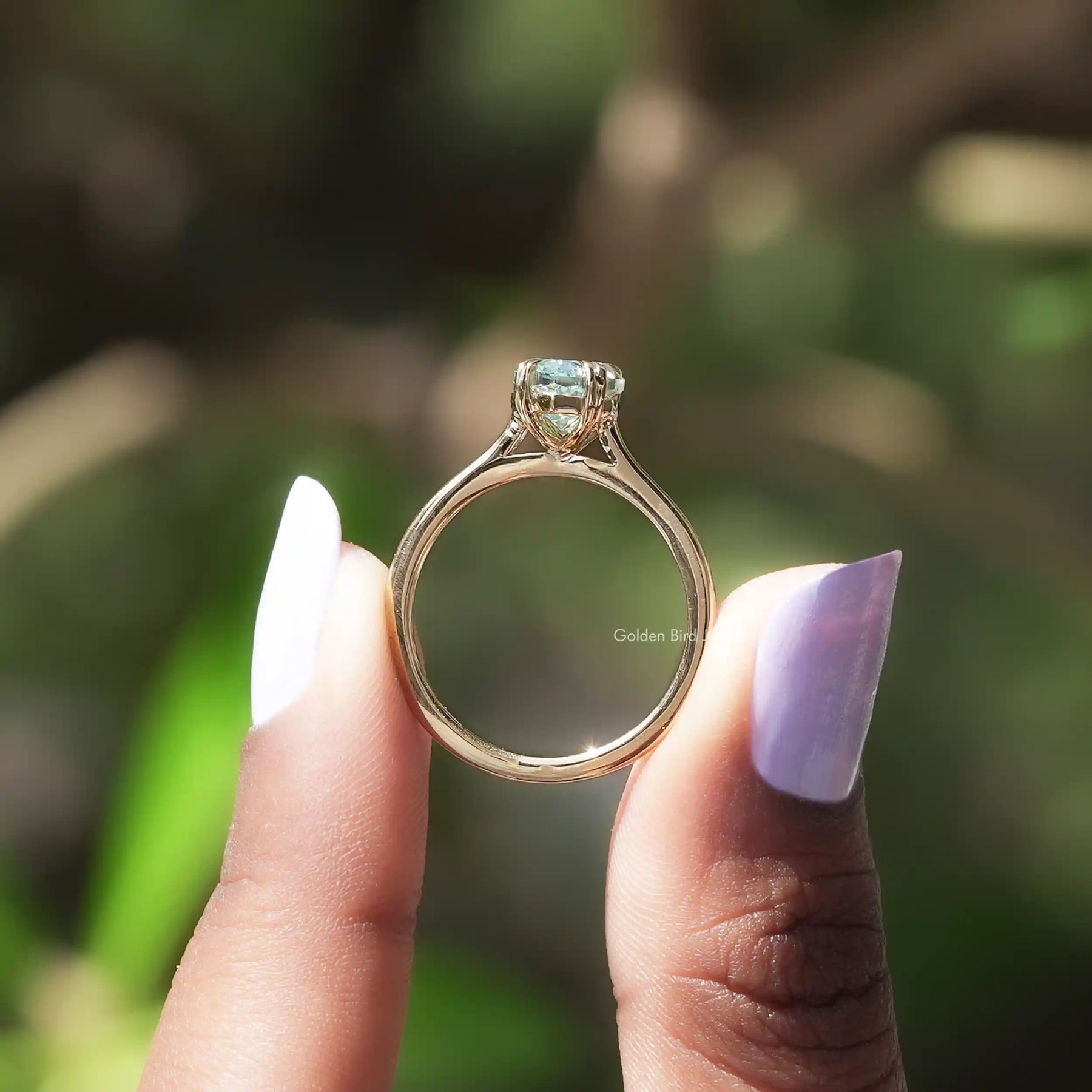 Back view of marquise solitaire ring in a secure setting