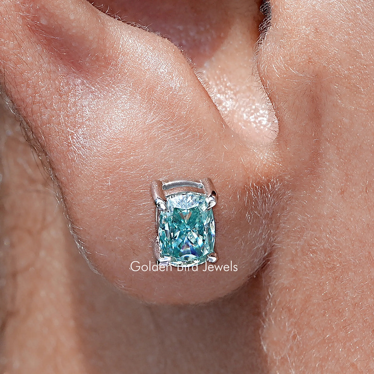 Front view of  Solid Blue elongated cushion Cut moissanite Stud Earrings
