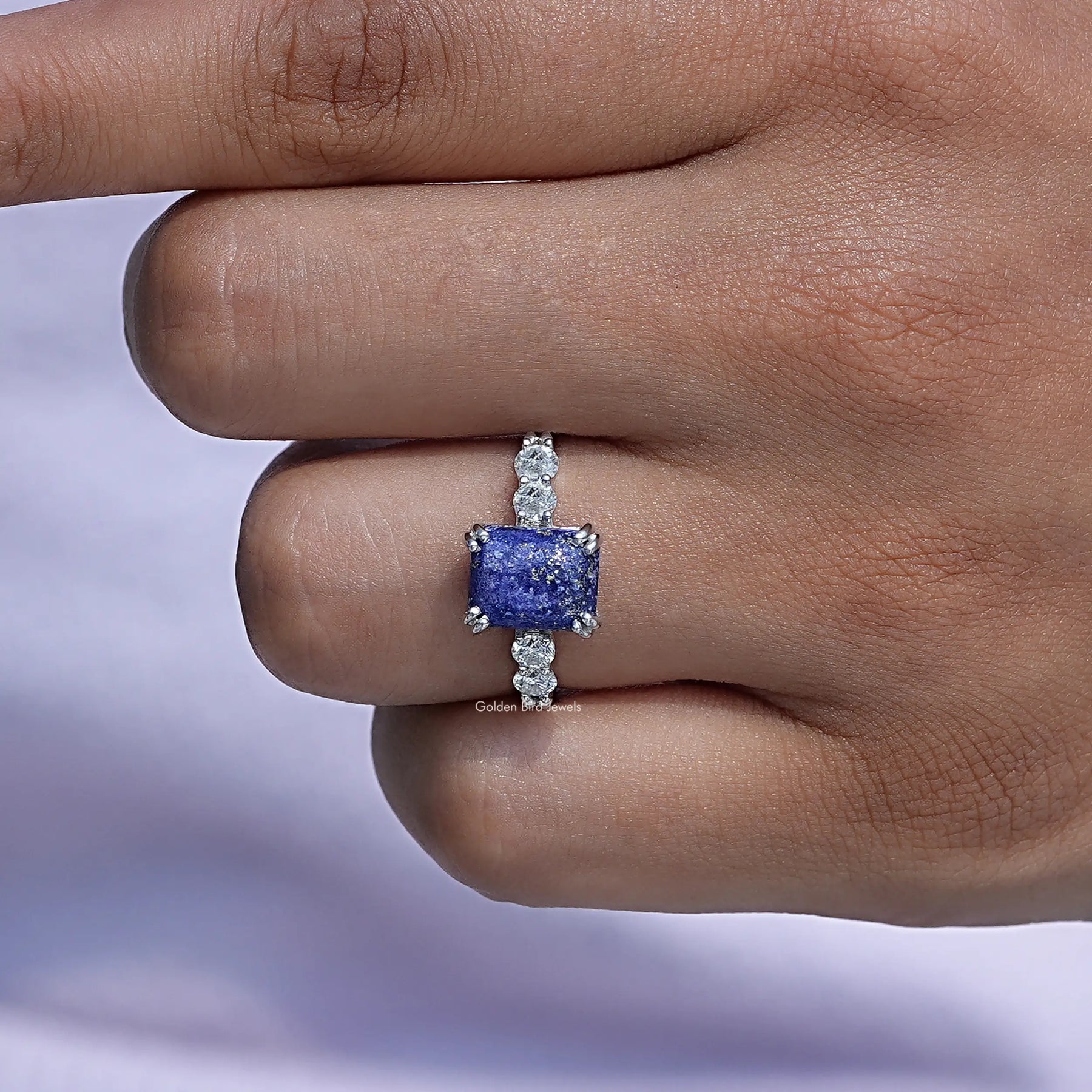 View of A Blue Emerald Cut Gemstone Engagement Ring