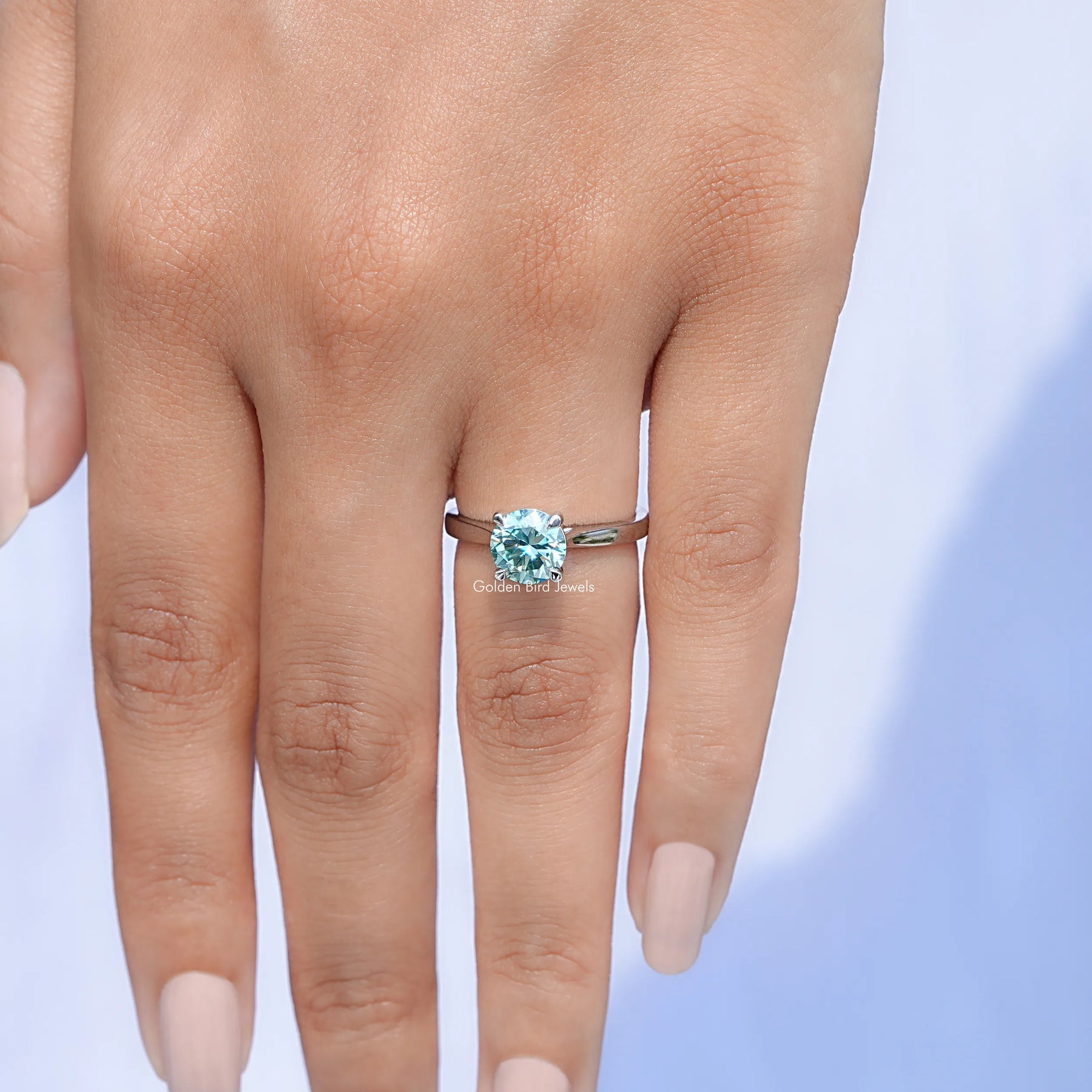Top view of Blue Green Round moissanite Solitaire Ring for women 's wear