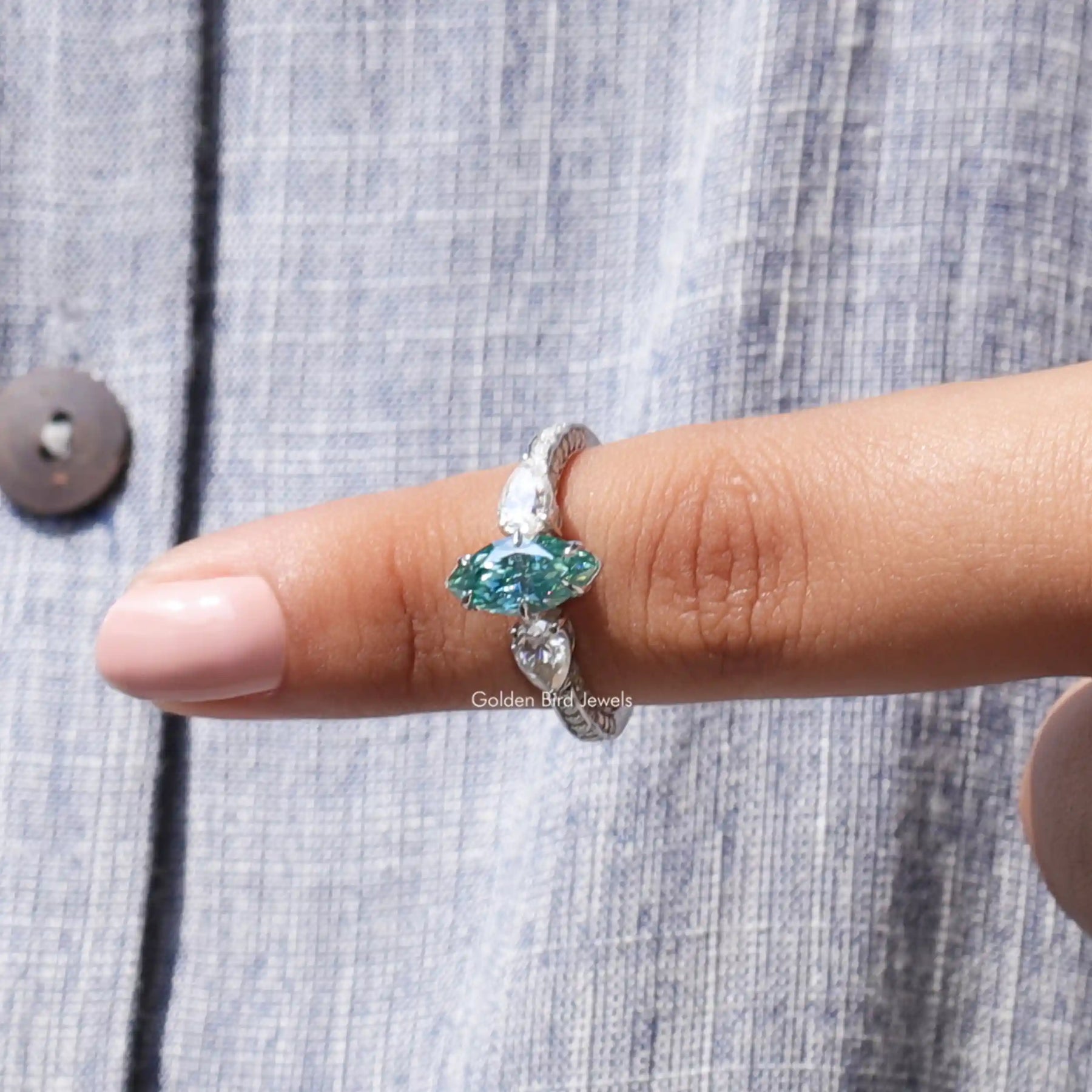 In finger front View of Blue Marquise Cut Moissanite Ring