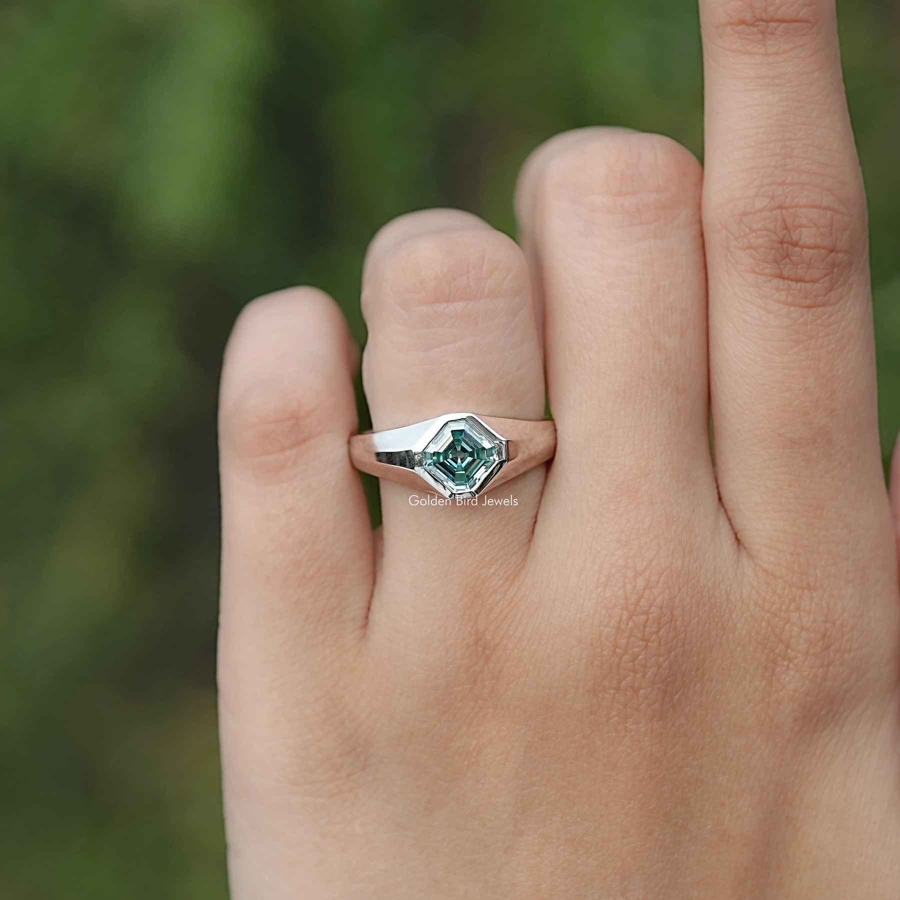 In finger front view of Moissanite Engagement Ring in Asscher Cut Stone