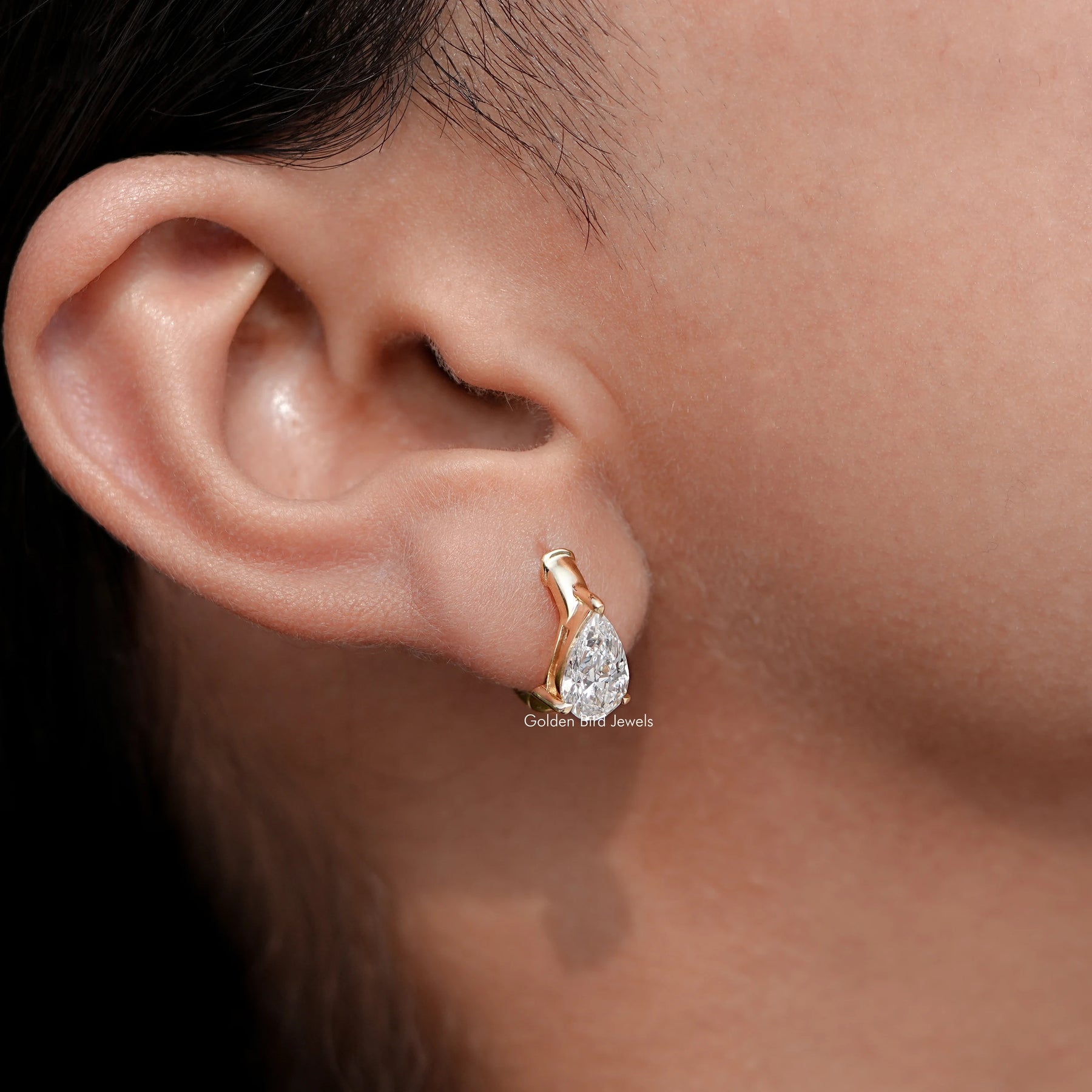 Side View of Diamond Solitaire Huggie Hoop Earrings In Yellow Gold