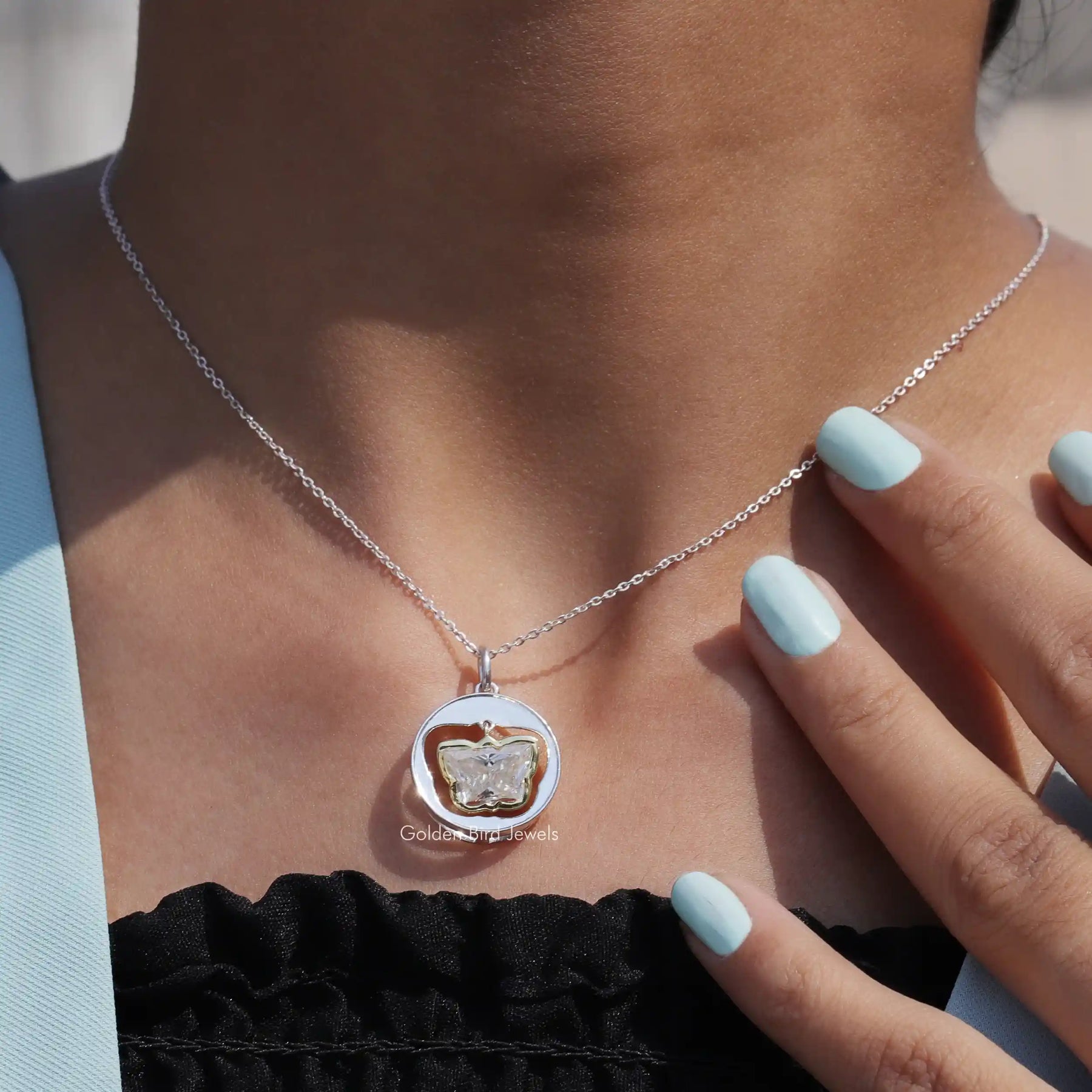 Detailed view of moissanite butterfly shape pendant