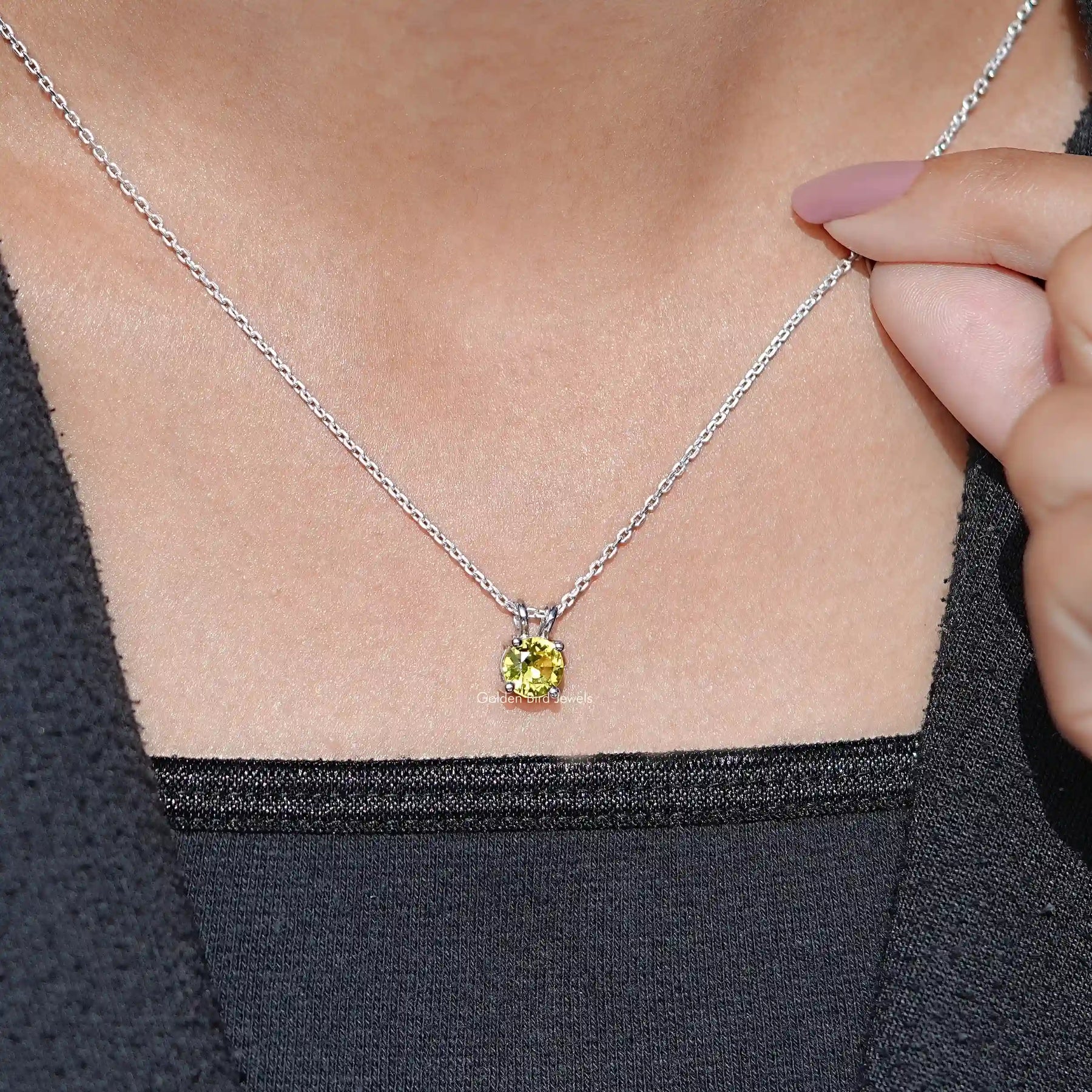 Detailed View Of Necklace With Gemstone Pendant In Yellow