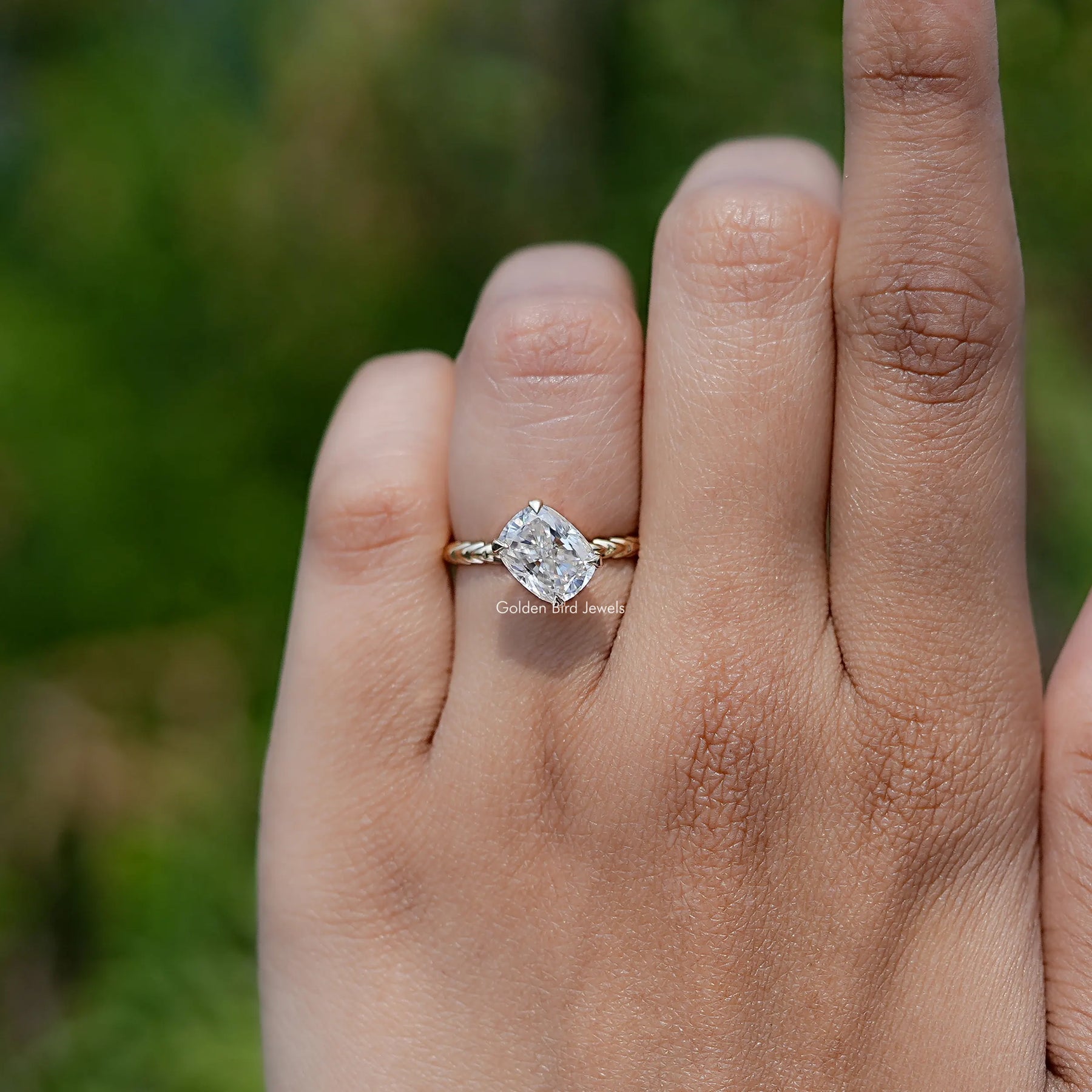 In finger front view of Cushion Cut Moissanite engagement ring