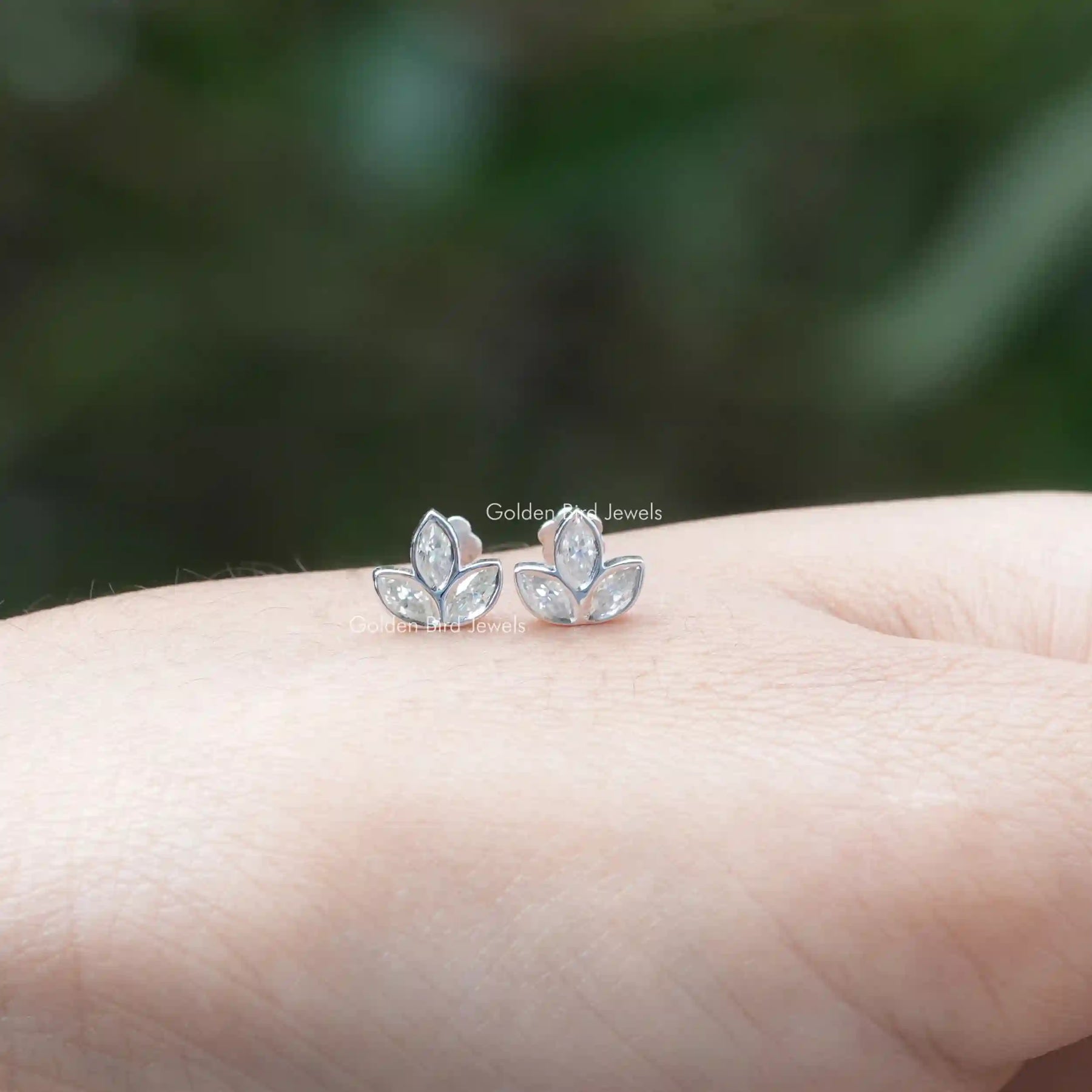Front view of colorless marquise stud earrings for women's wear