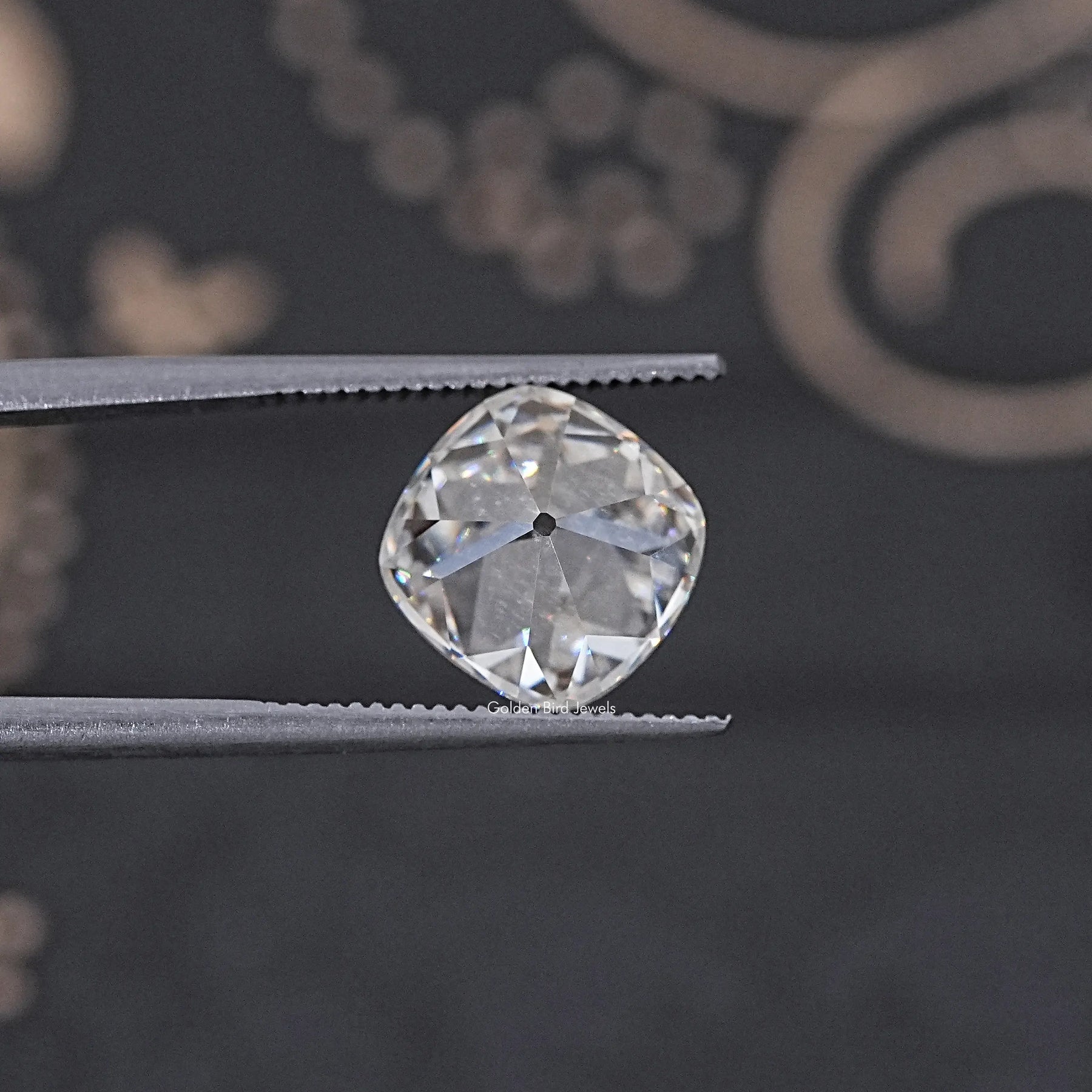 In Tweezer View Of Old Mine Cushion Cut Loose Moissanite Stone