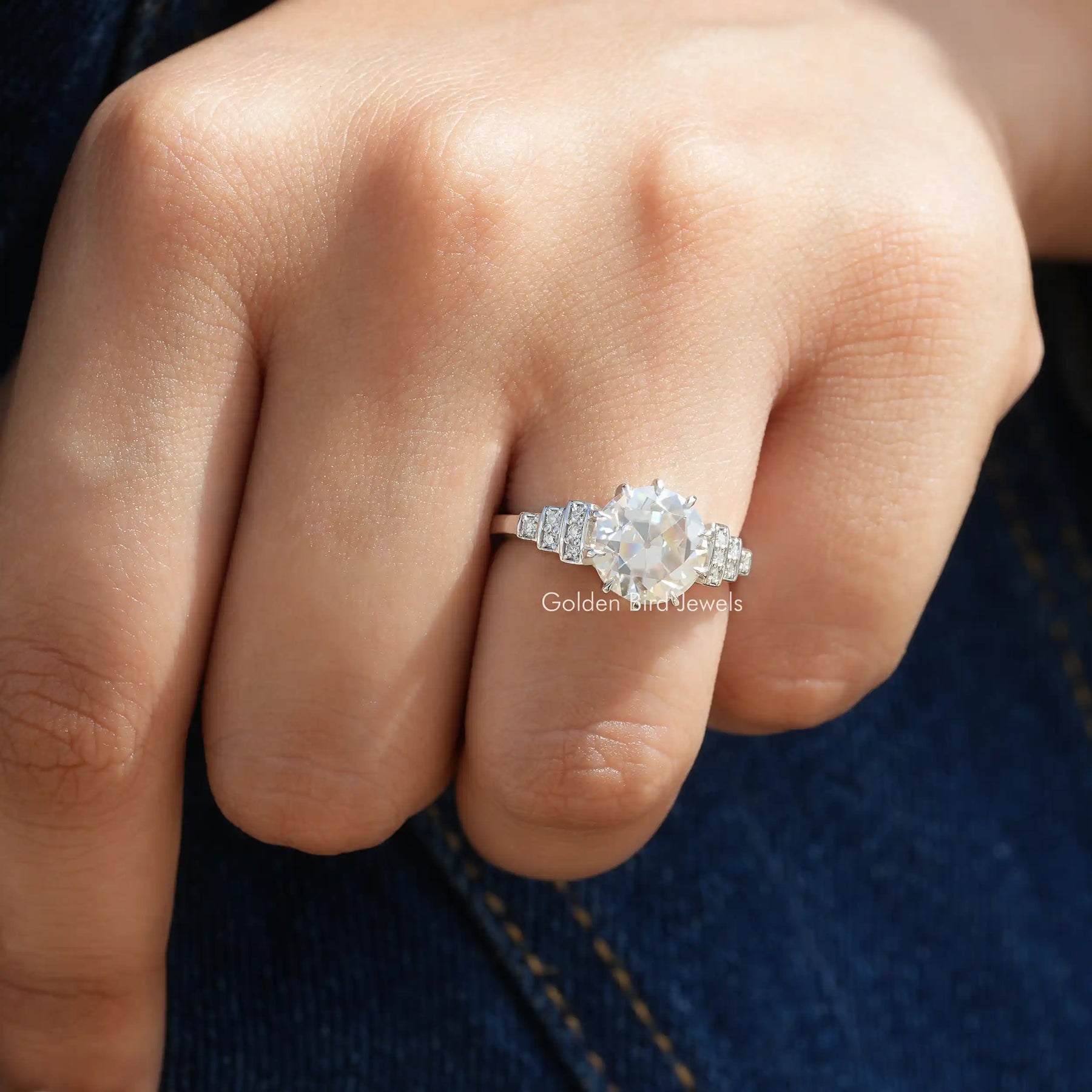 Close-Up View of Round Cut Moissanite Accent Ring In White Gold
