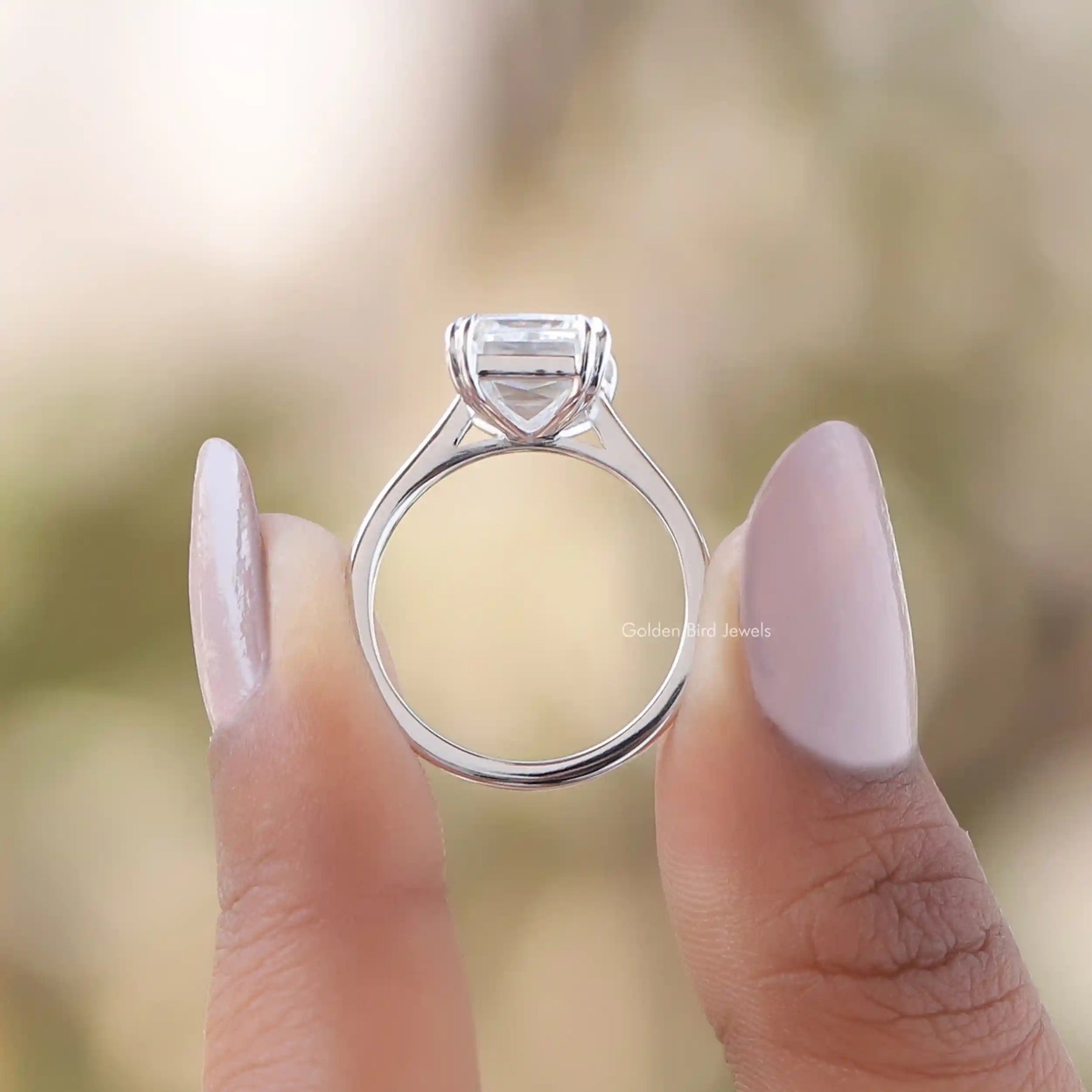 Back View of Criss Cut Moissanite Ring In two fingers