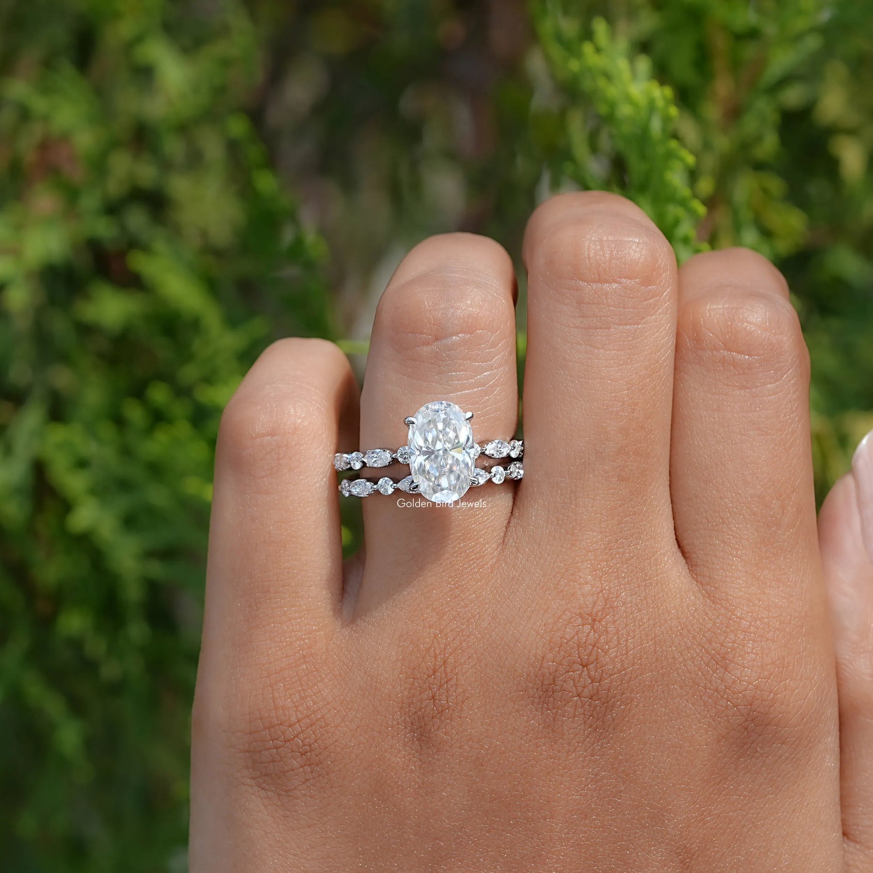 In finger front view of Crushed ice Oval Cut moissanite Bridal Set ring