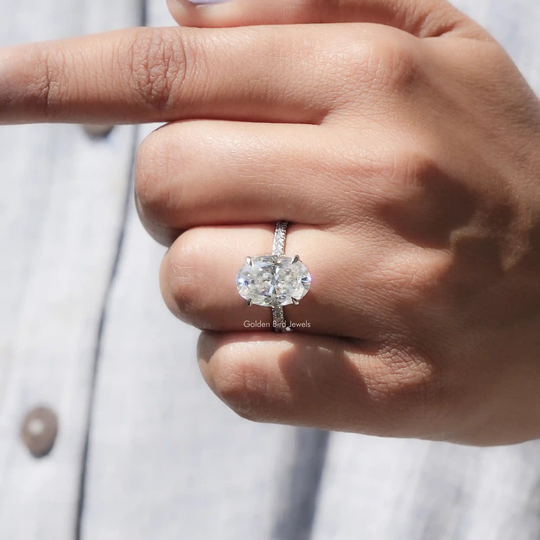 View of Crushed Ice Oval Cut White Gold Ring In finger