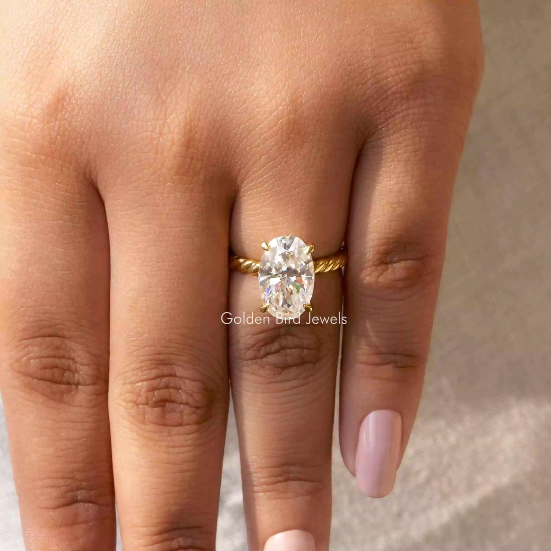 Detailed View Of Oval Cut Moissanite Ring Set In Yellow Gold