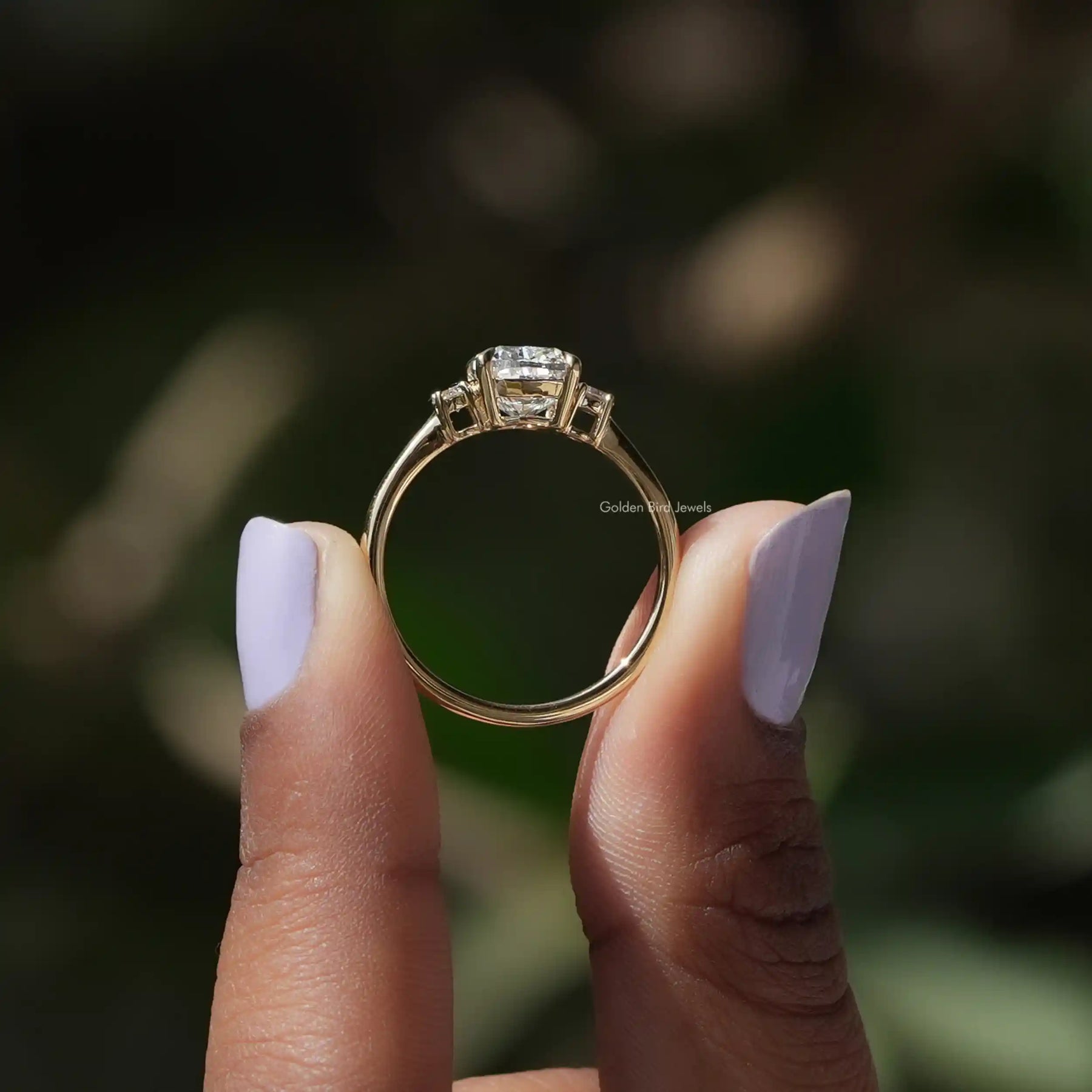 Back View of A Cushion And Round Cut 3 Stone Ring