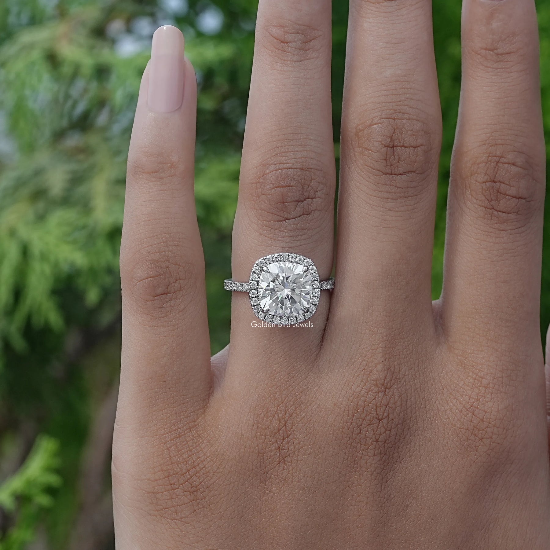 View of Cushion Cut Halo Engagement Ring In White Gold