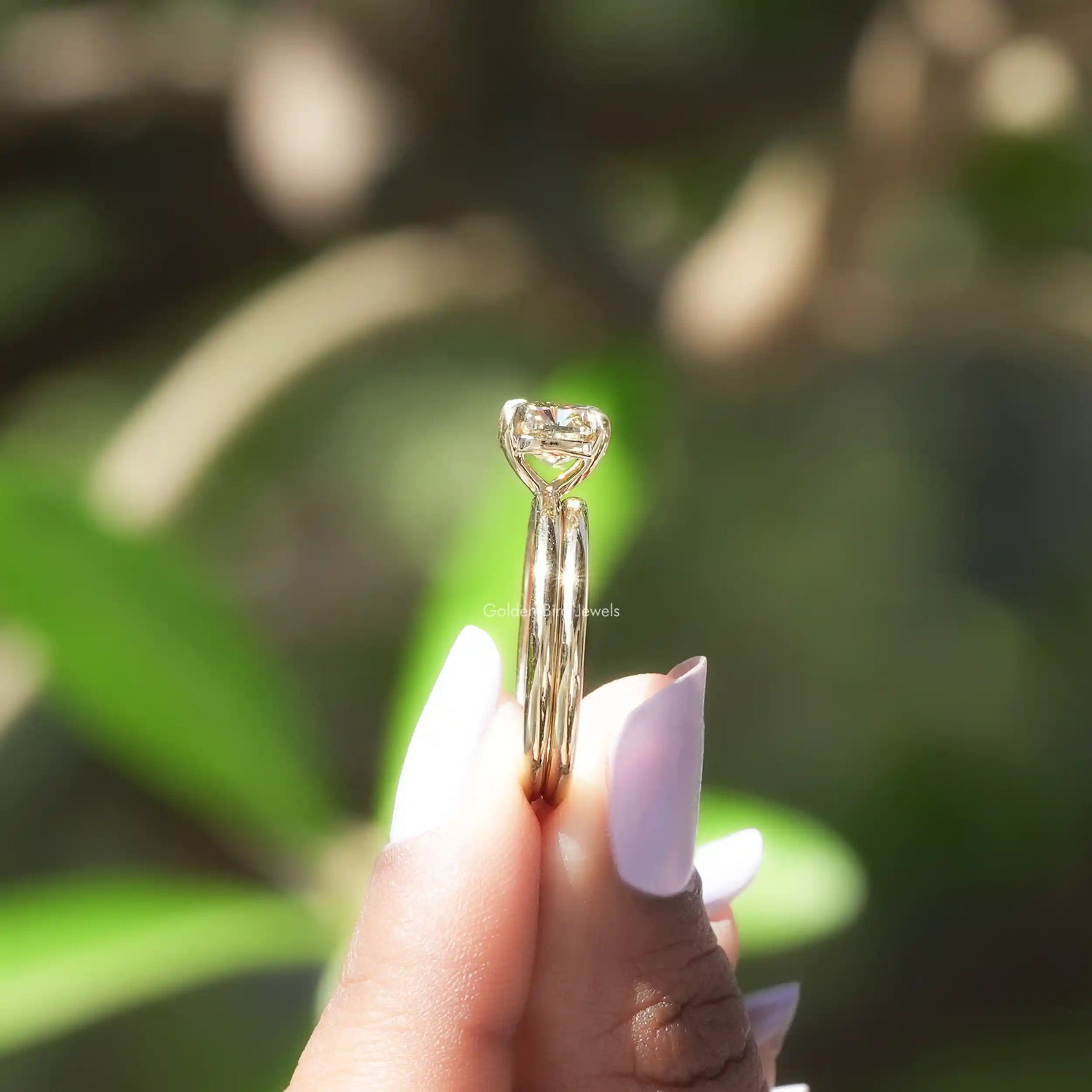 side view of a solitaire cushion cut moissanite ring for women