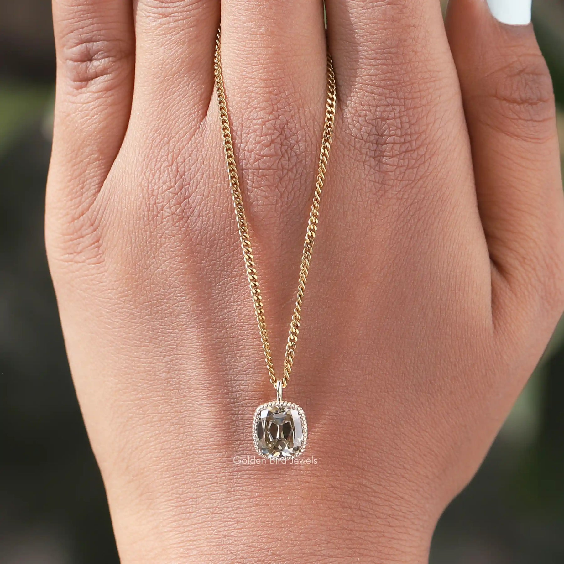 Full view of moissanite pendant in unique shape