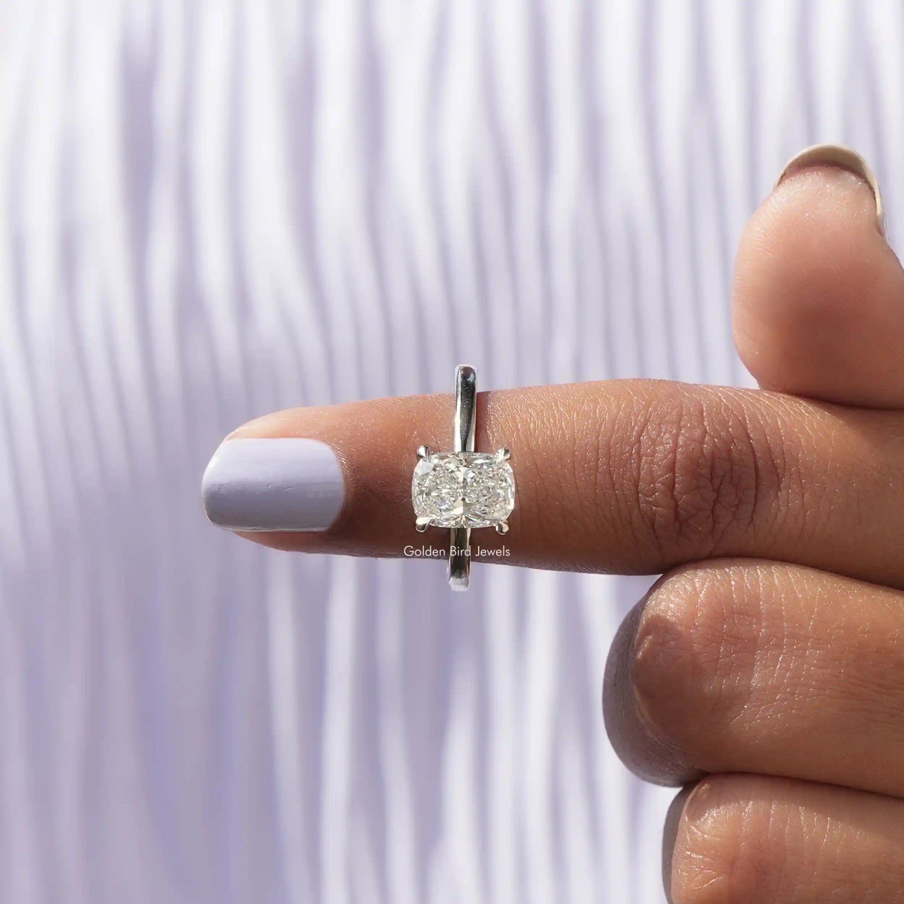 In finger front View of Cushion Cut Solitaire Engagement Ring