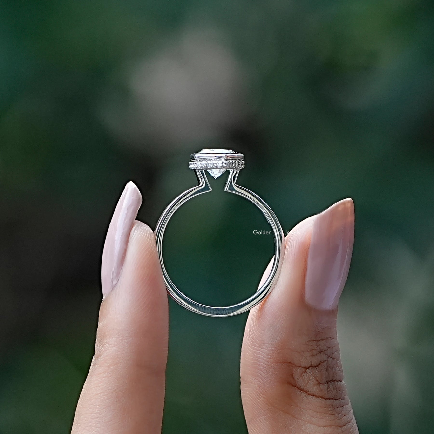 Back View of Marquise Cut Hidden Halo Ring In two fingers
