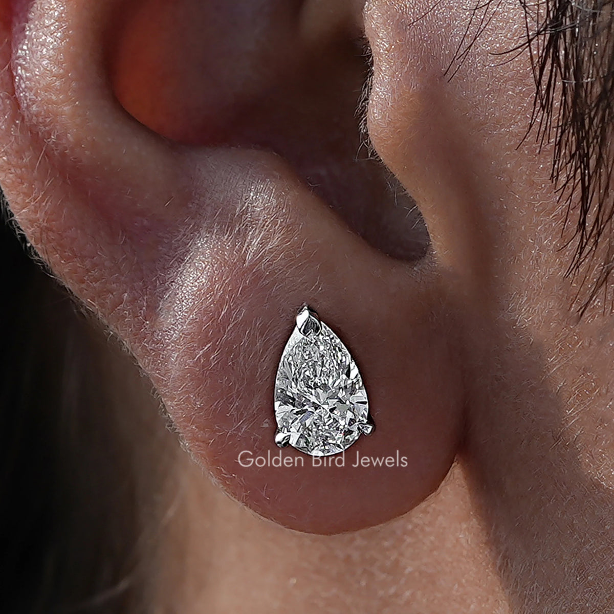 Close Up View Of Pear Cut Diamond Solitaire Stud Earrings