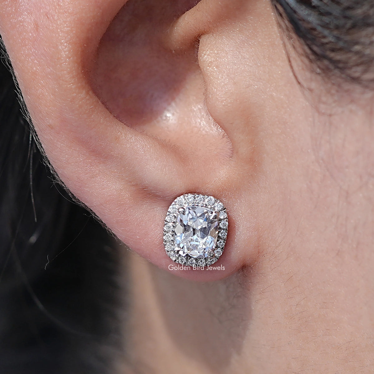 close up view of Elongated Old Mine Cushion Diamond Halo Earrings