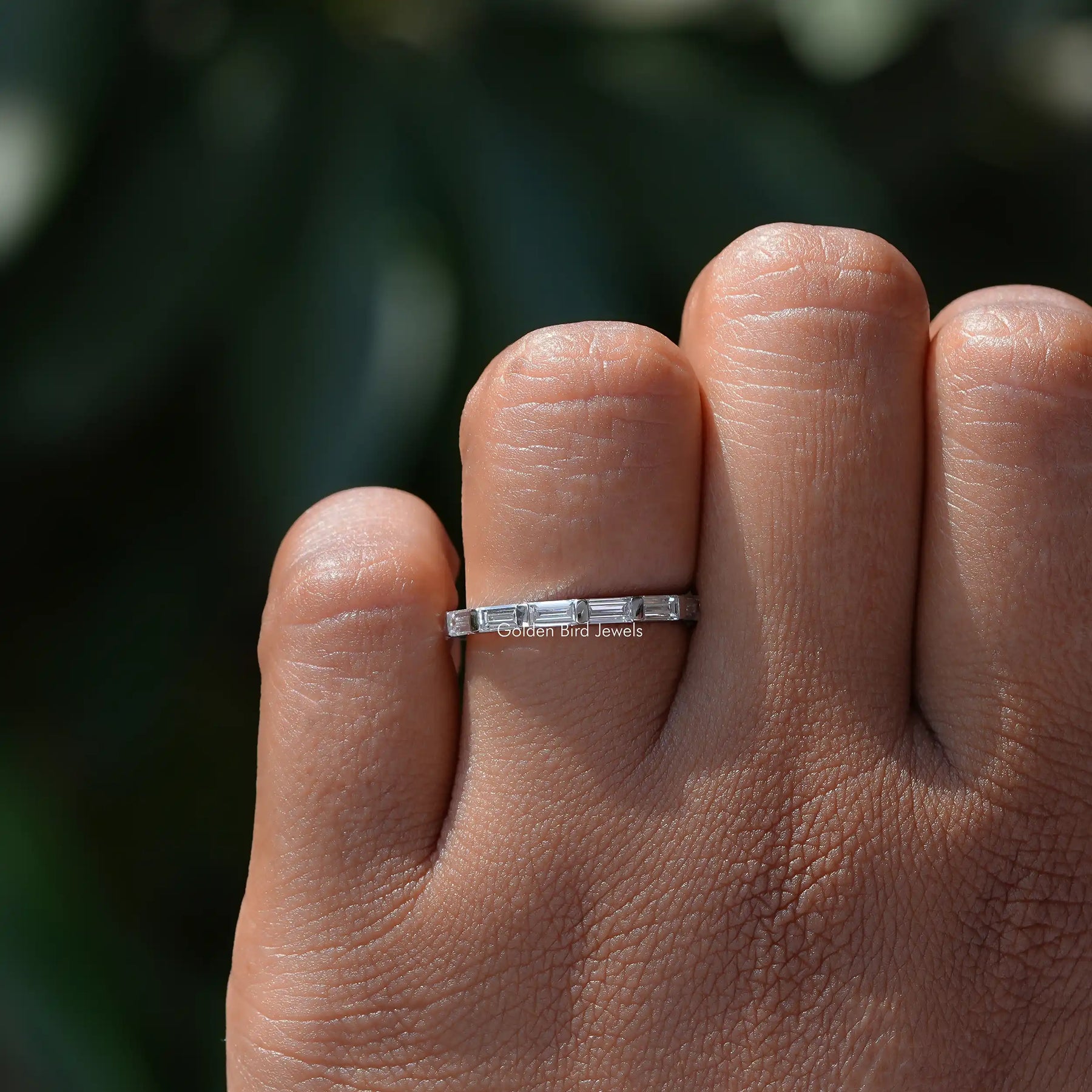 View of East West Baguette Cut Diamond Wedding Band In Finger