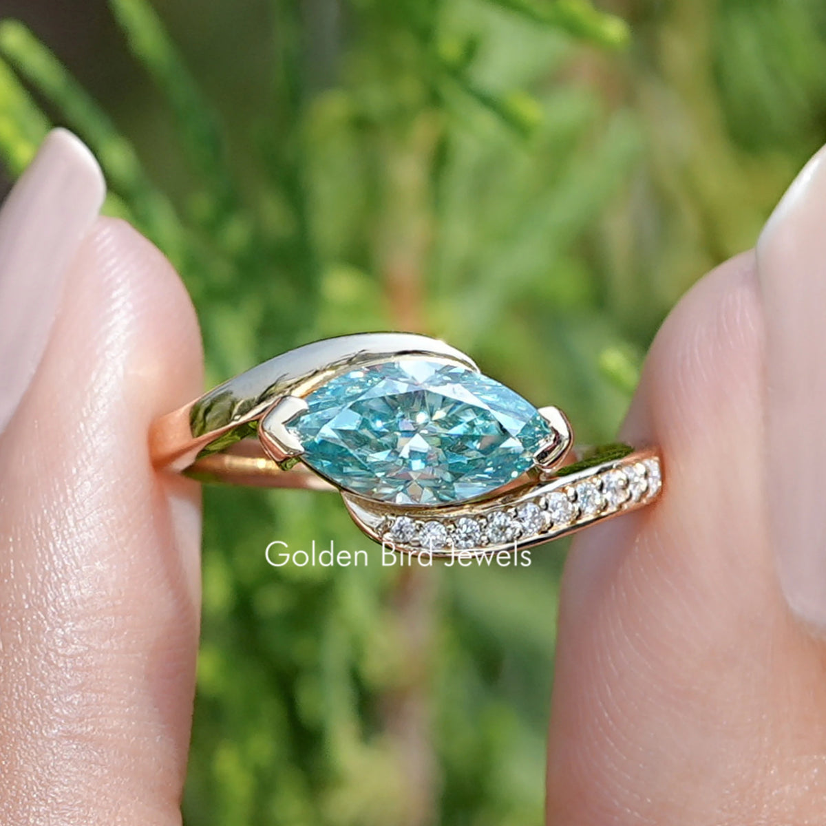 Front view of East West Blue Marquise Moissanite Bypass Ring