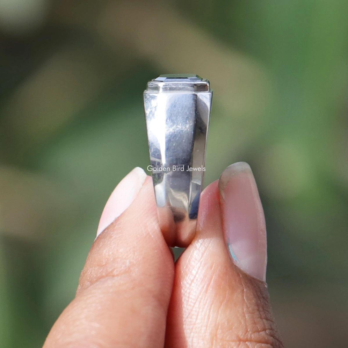Side view of East West Emerald cut Ring in White gold