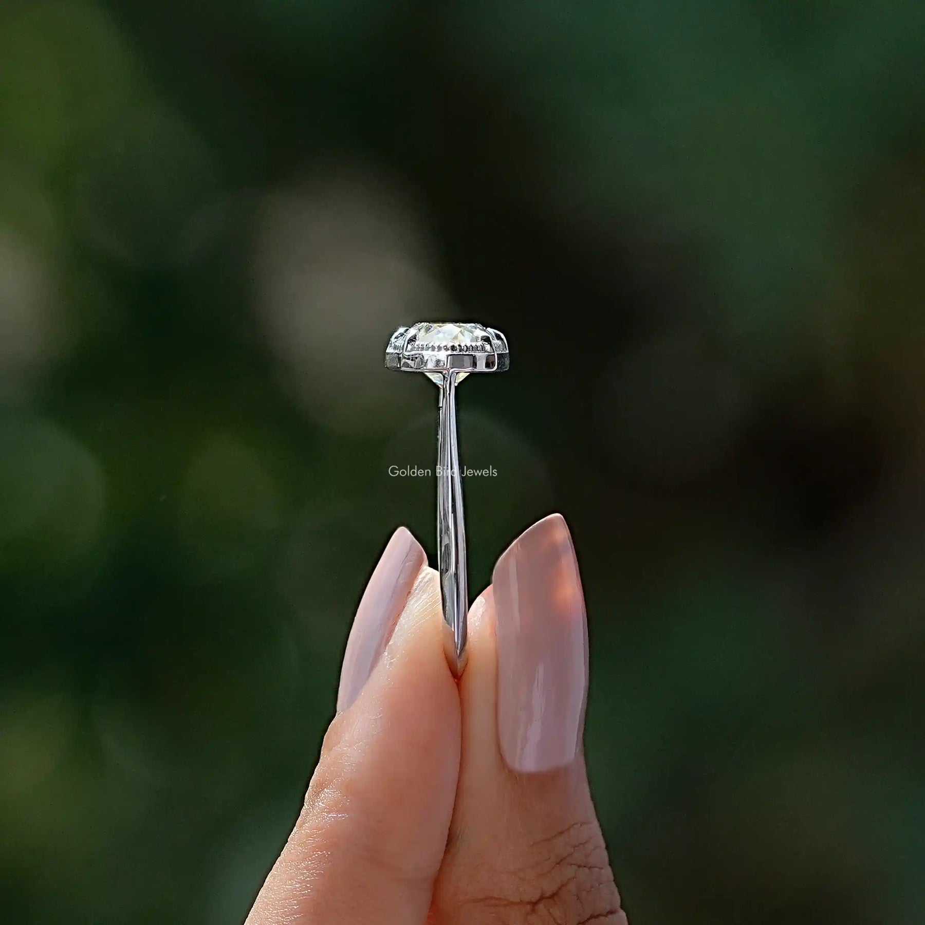 Side View of Moval Cut Moissanite East West Ring In two fingers