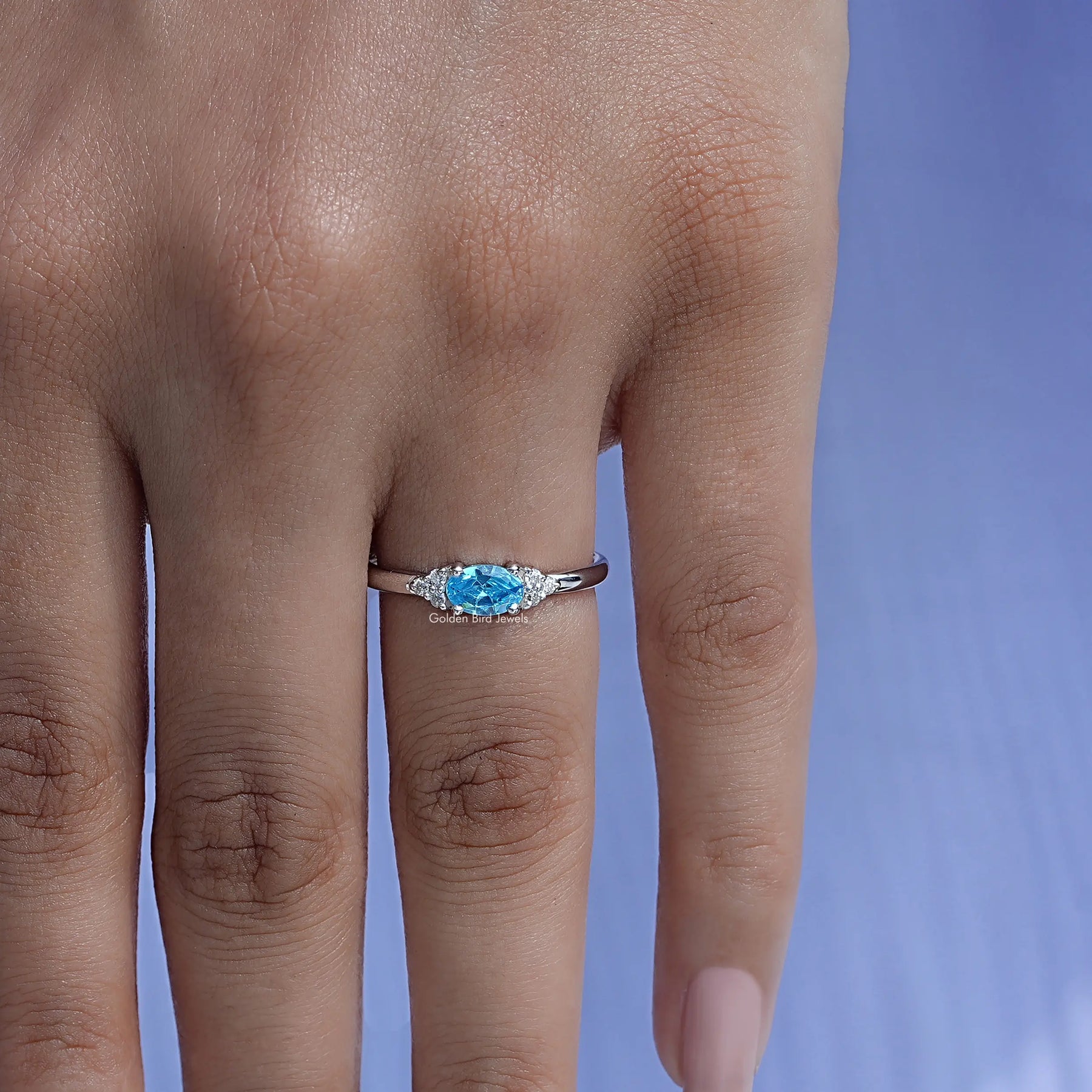 Profile View of Emerald Cut Gemstone Engagement Ring in white gold