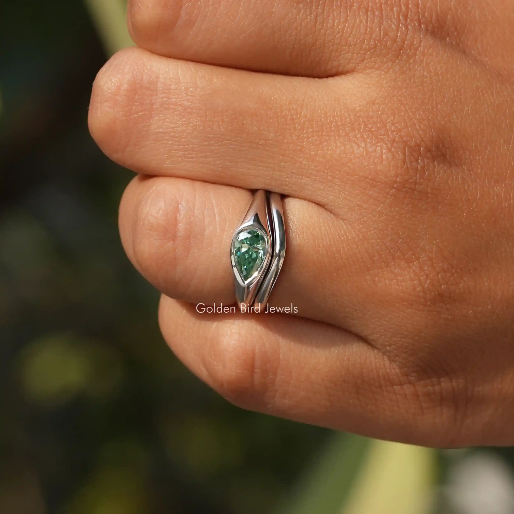 Close-Up View of Pear Cut East West Solitaire Ring In White Gold