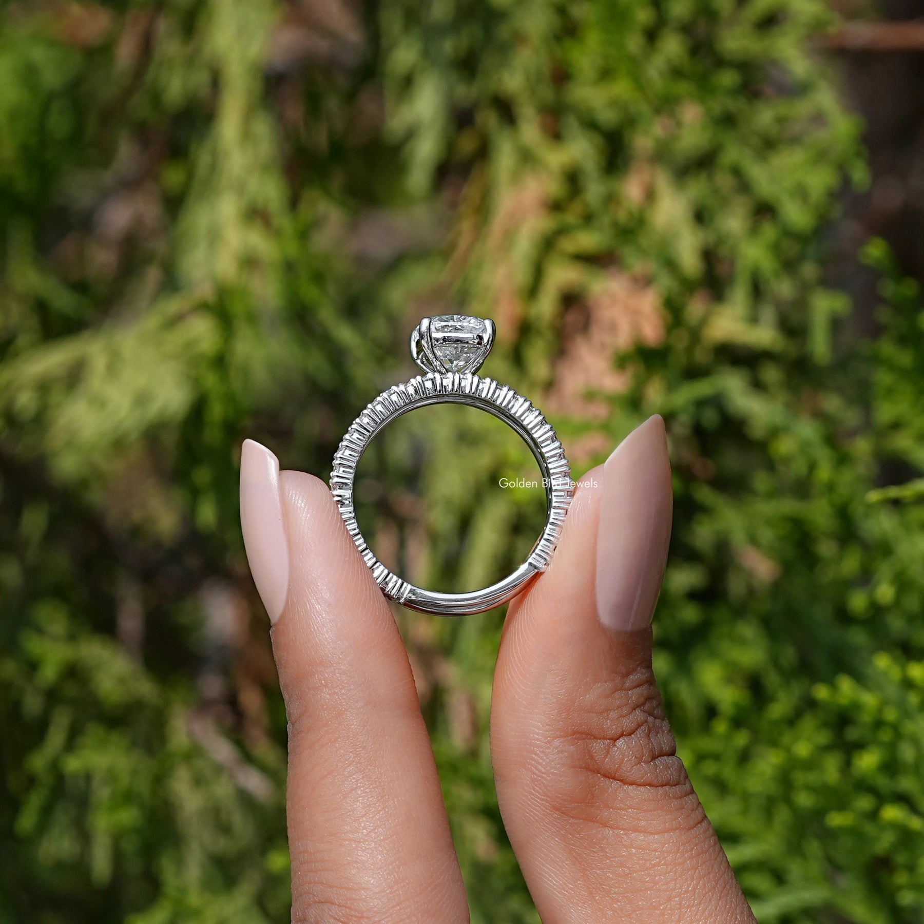 Back View of A Cushion Cut Lab Grown Diamond Ring in two fingers