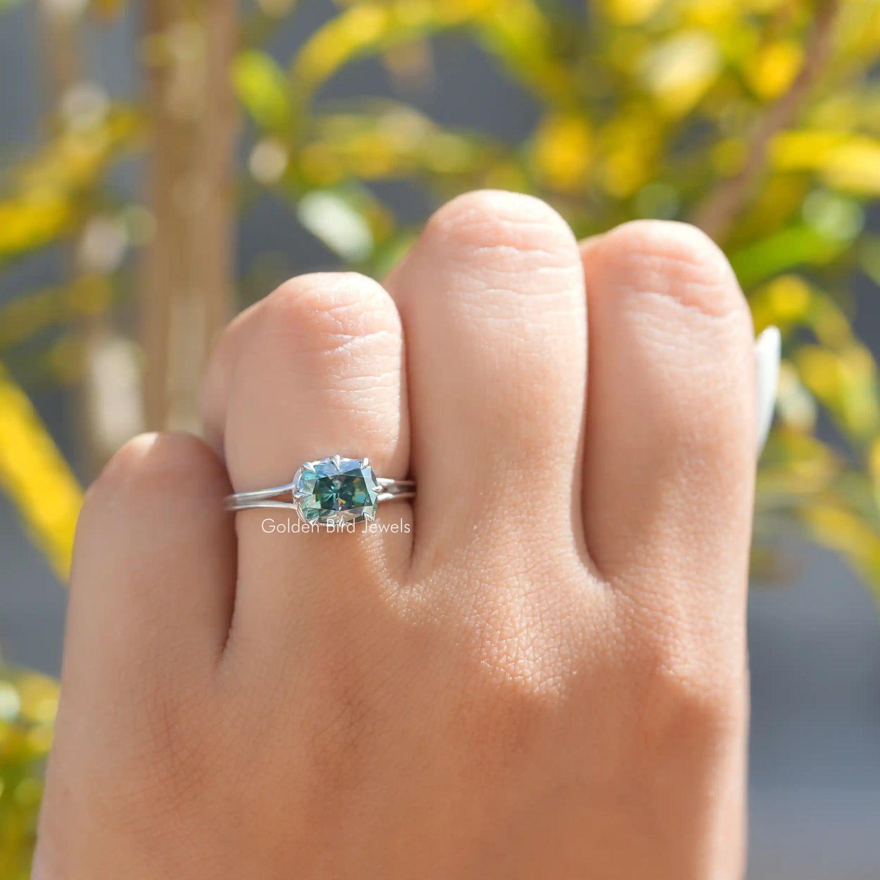 View of Green Elongated Cushion Cut Moissanite Engagement Ring In White Gold