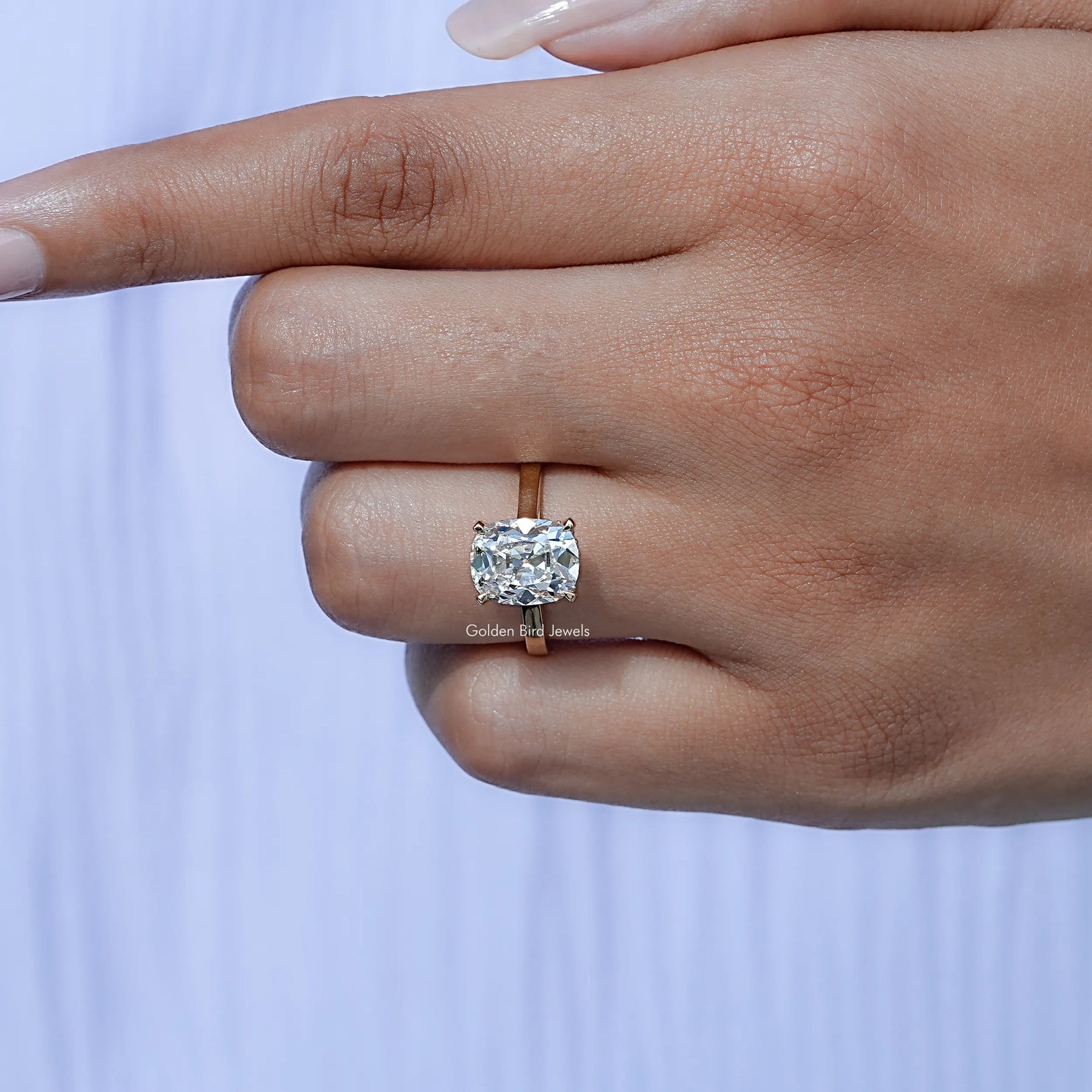 View of Cushion Cut Diamond Halo Engagement Ring In Yellow Gold