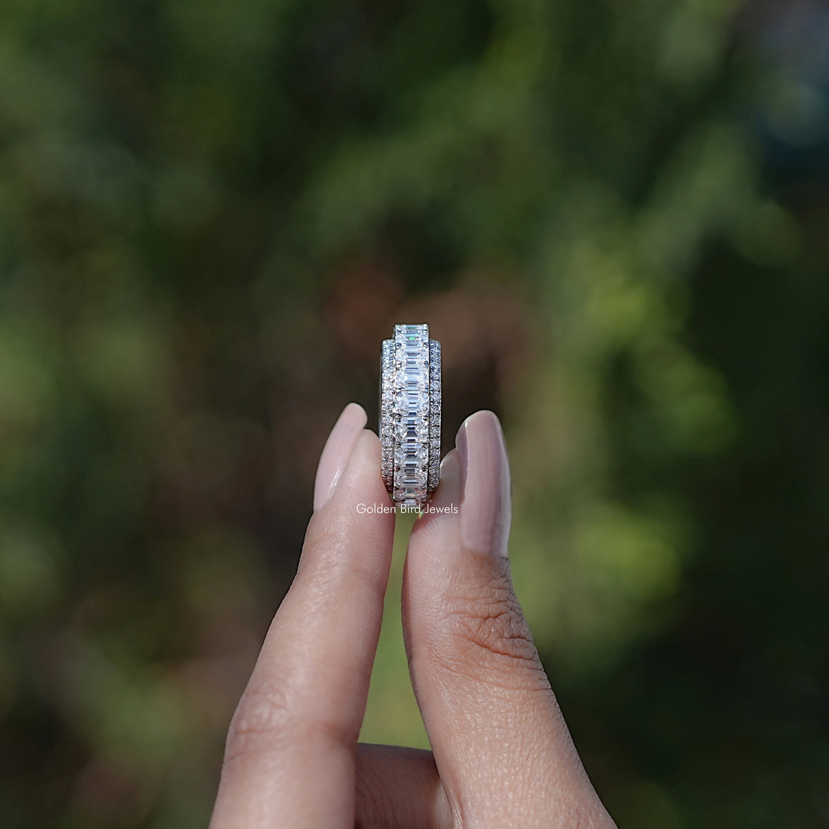Side View of Emerald and Round Cut moissanite three row band