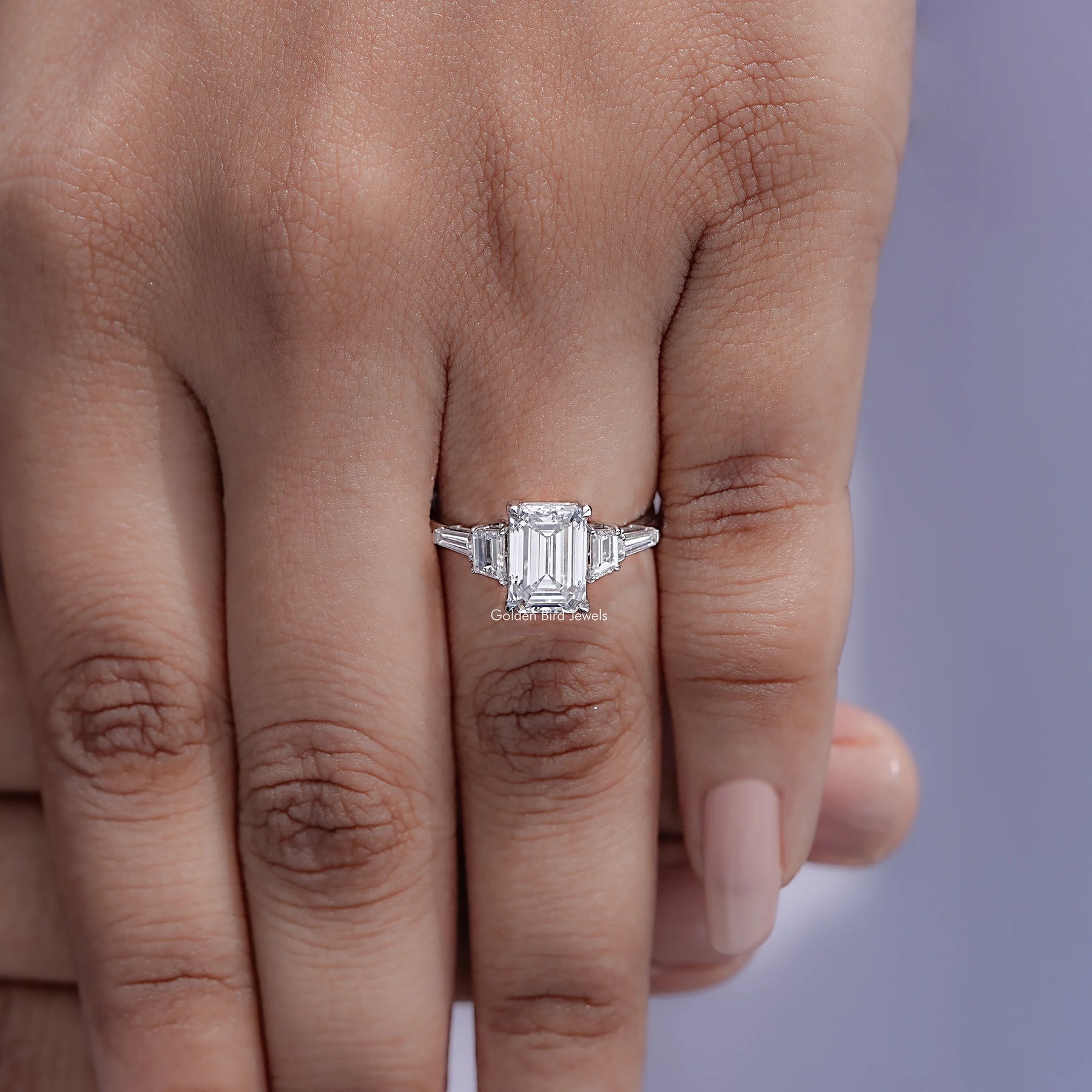 Detailed view of Emerald And Tapered Baguette Diamond Ring