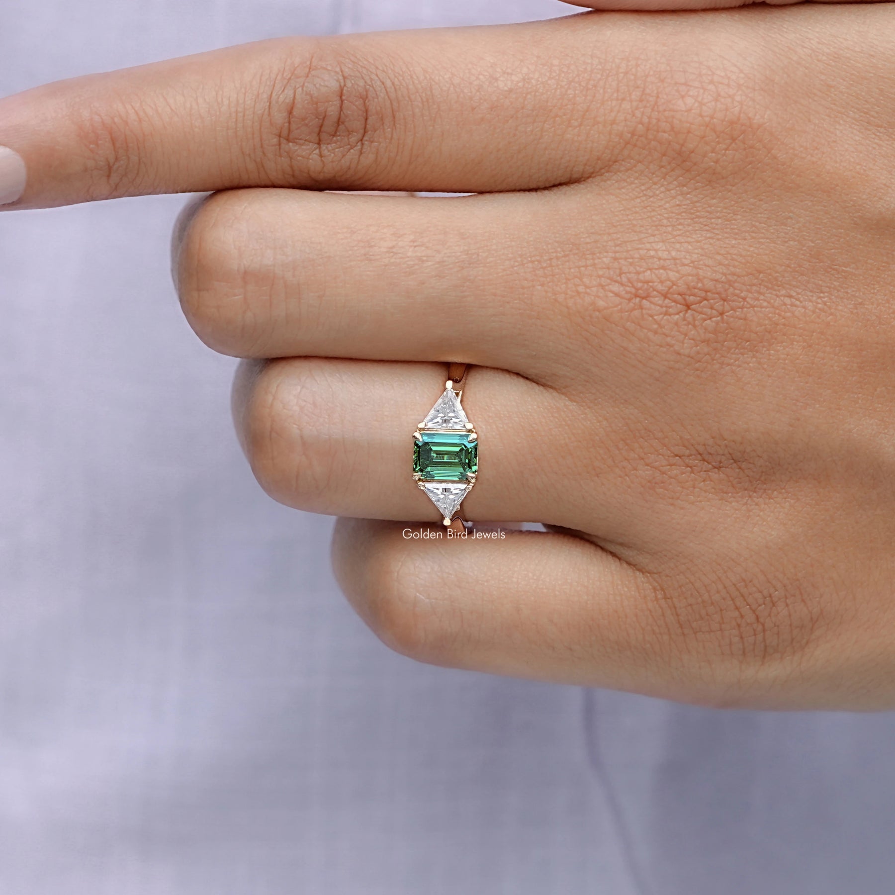 Emerald And Triangle Moissanite Three Stone Ring