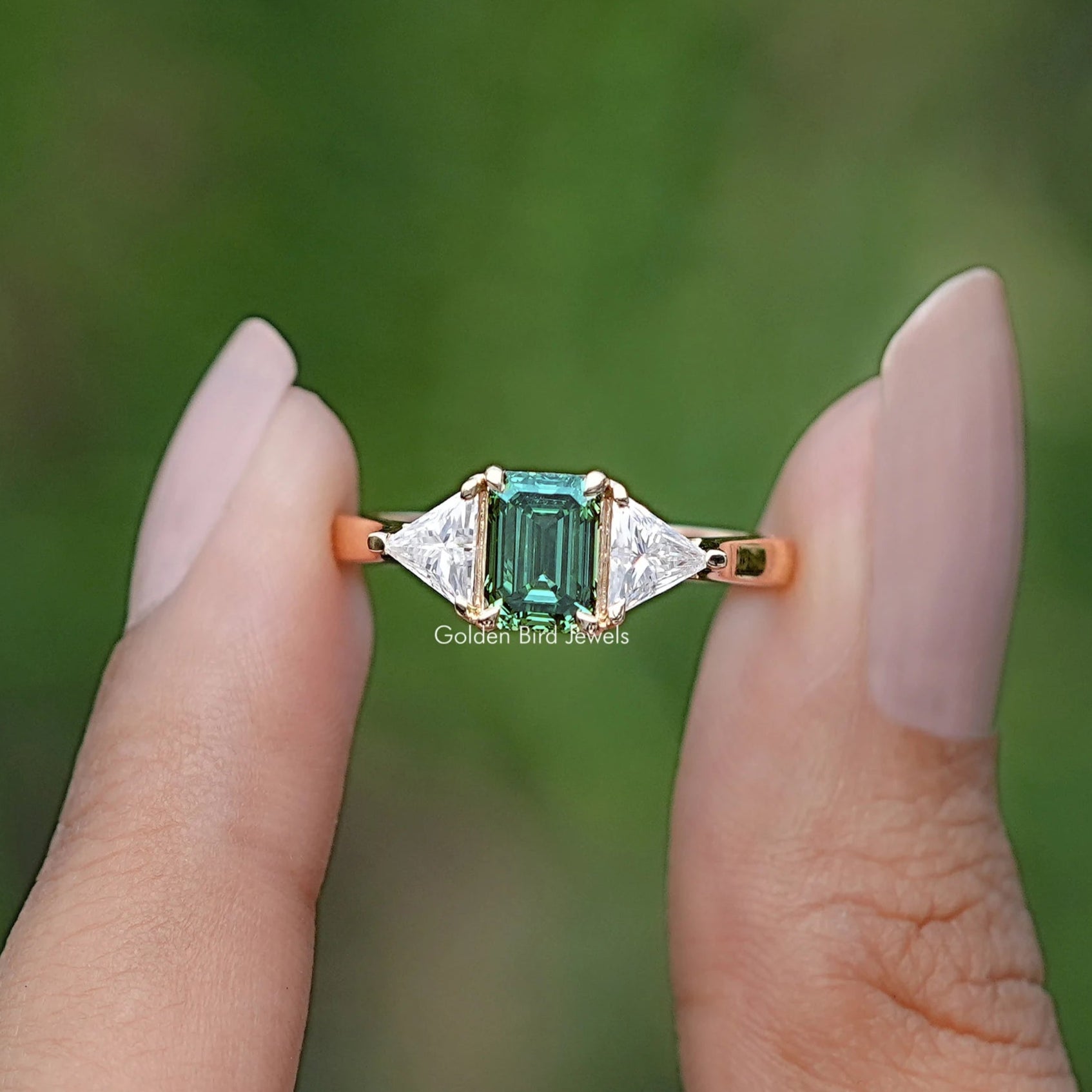 Emerald And Triangle Moissanite Three Stone Ring